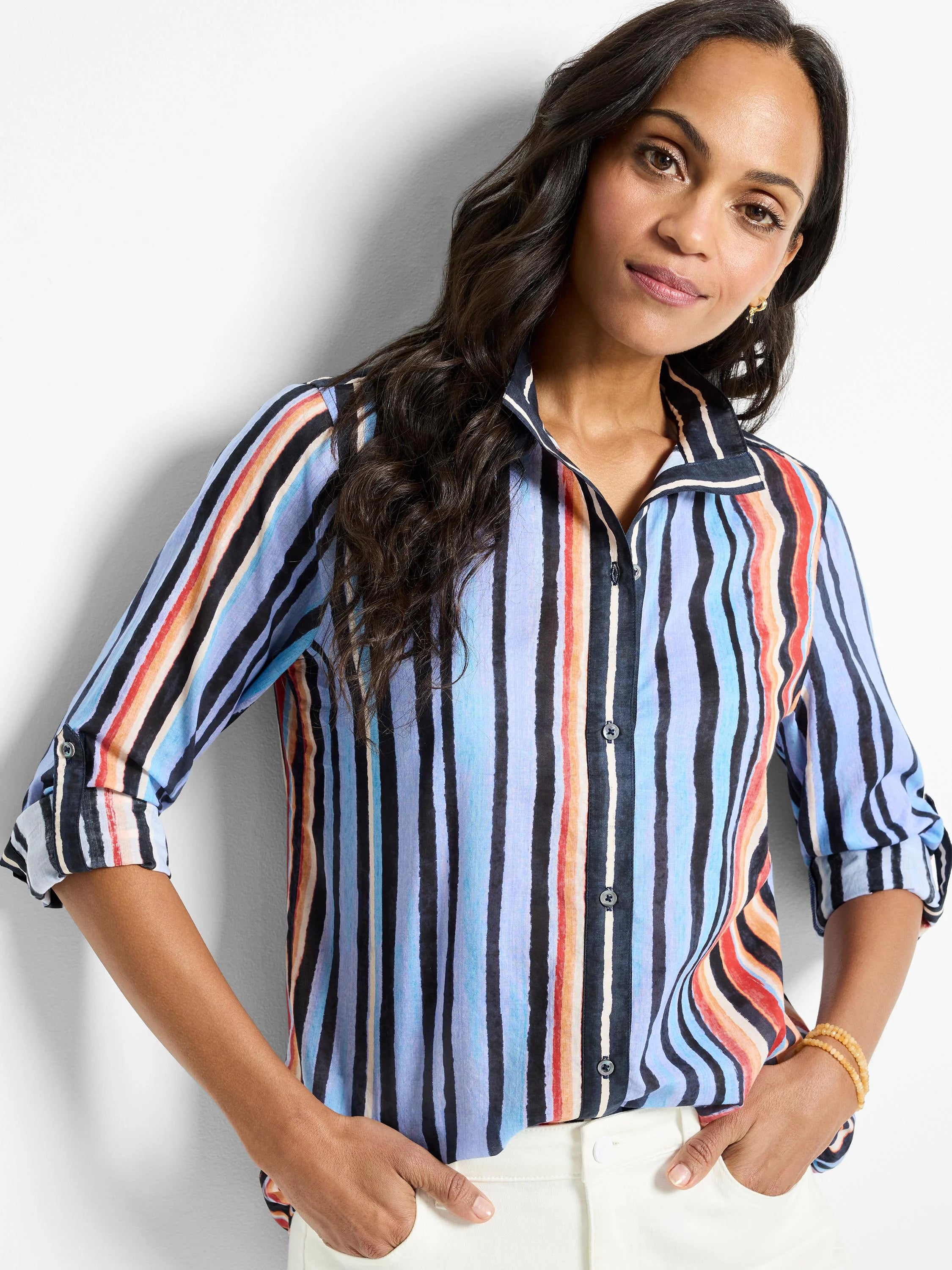 Cotton shirt; vertical stripes in blue, black, orange, and red on a light blue background. Three-quarter sleeves, button...