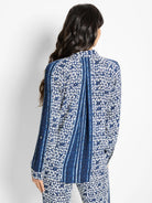 Blue and white patterned long-sleeve shirt; geometric print with vertical stripes.