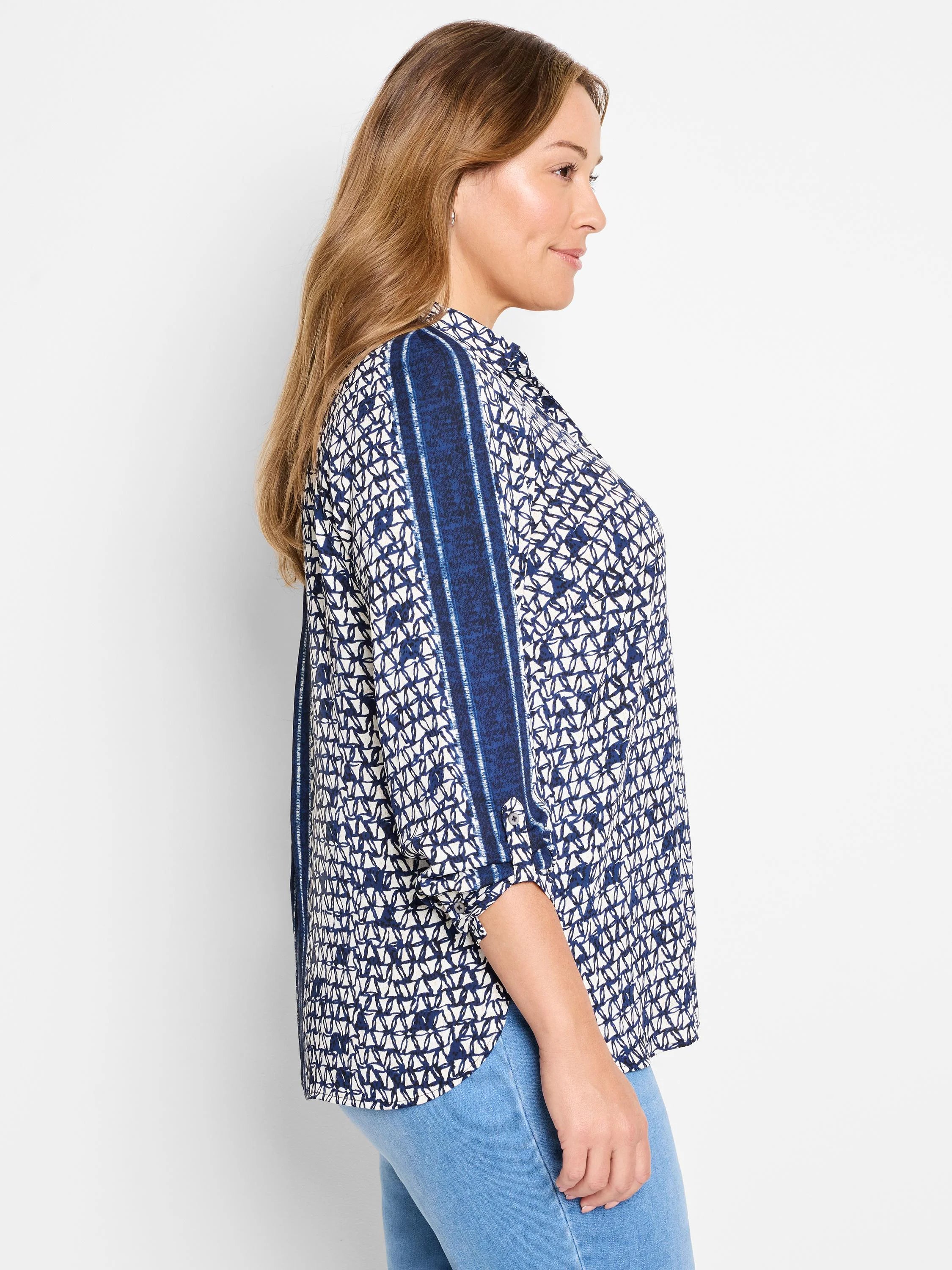 Off-white shirt with navy blue geometric pattern & vertical stripes on sleeves. 3/4 sleeves.