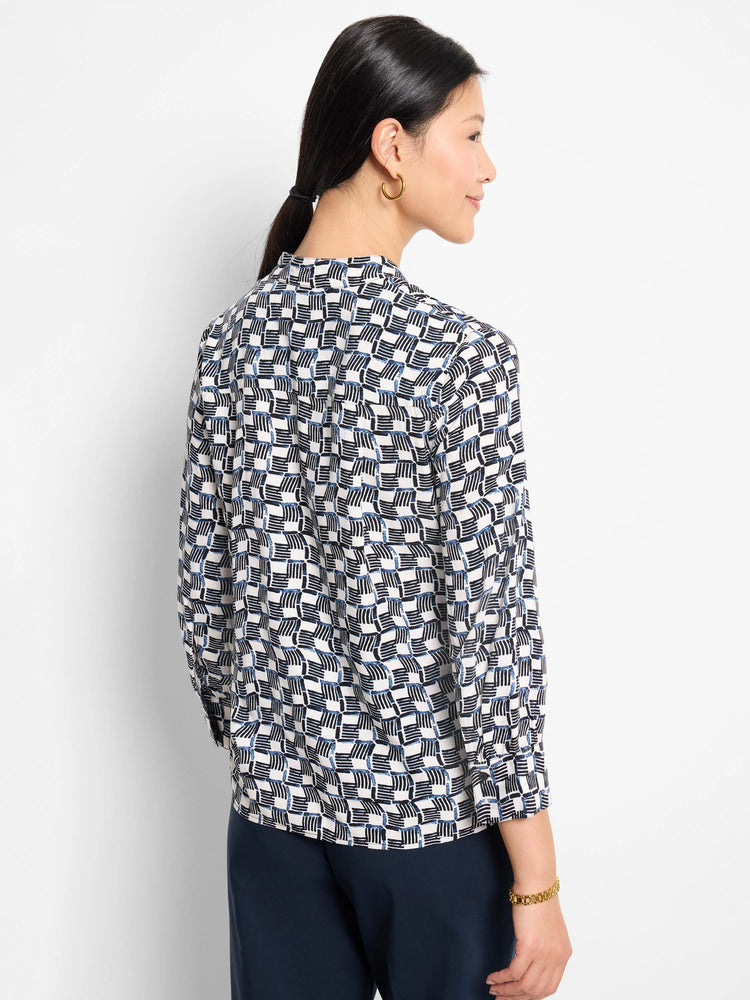 Off-white shirt with a navy and black geometric basketweave pattern. Three-quarter sleeves. Back view.