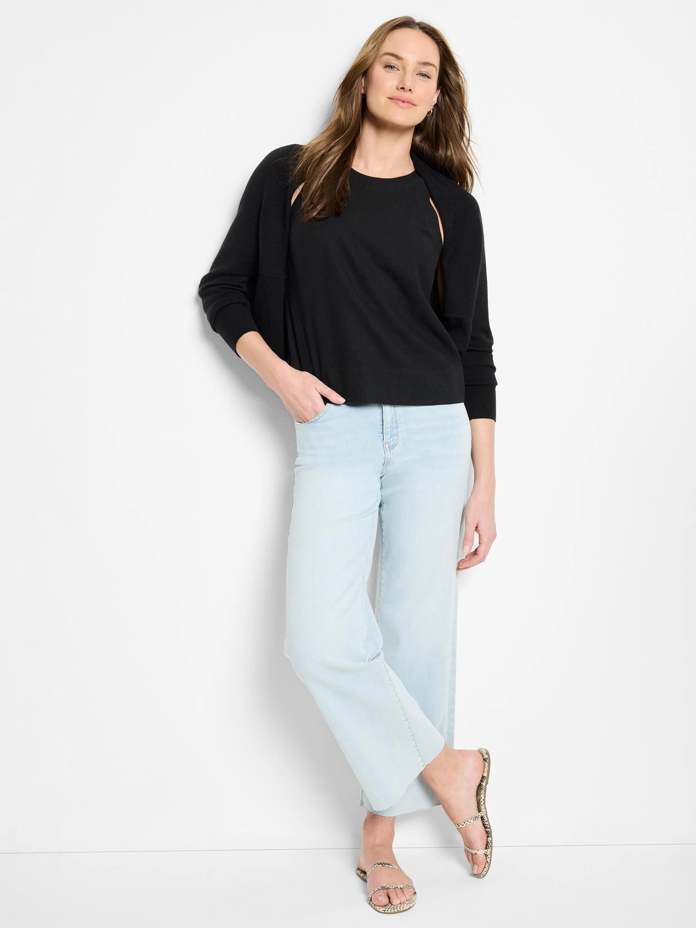 Black linen tank top; model wears light blue jeans and neutral sandals.