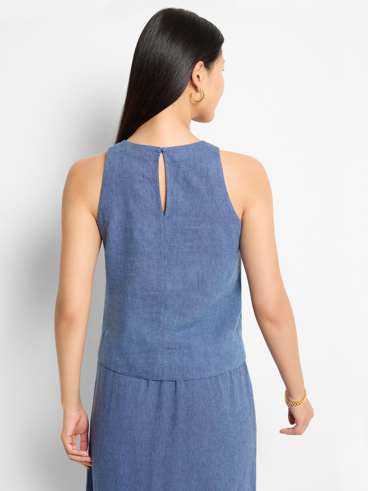 Blue linen sleeveless tank top; keyhole back detail. Shown on model.