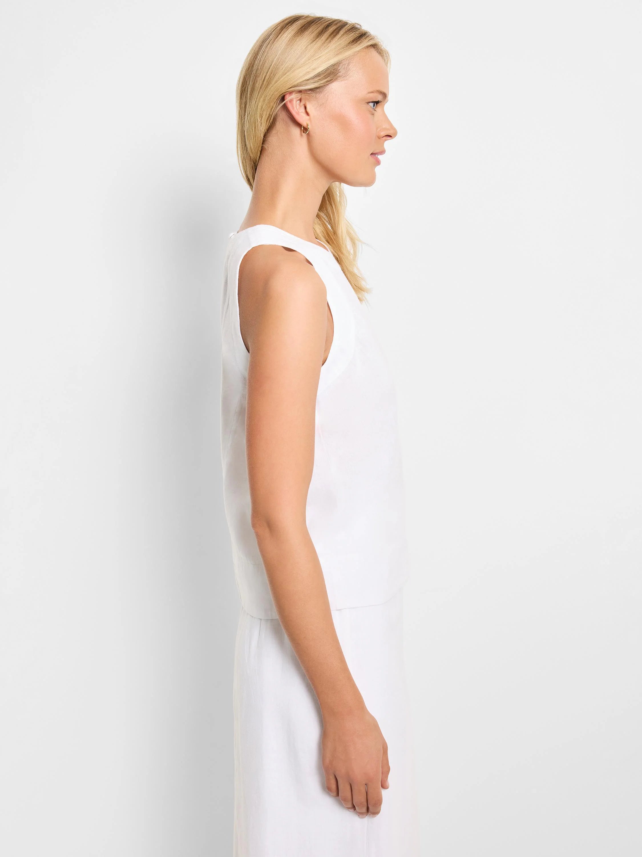 White linen sleeveless tank top, shown in profile.