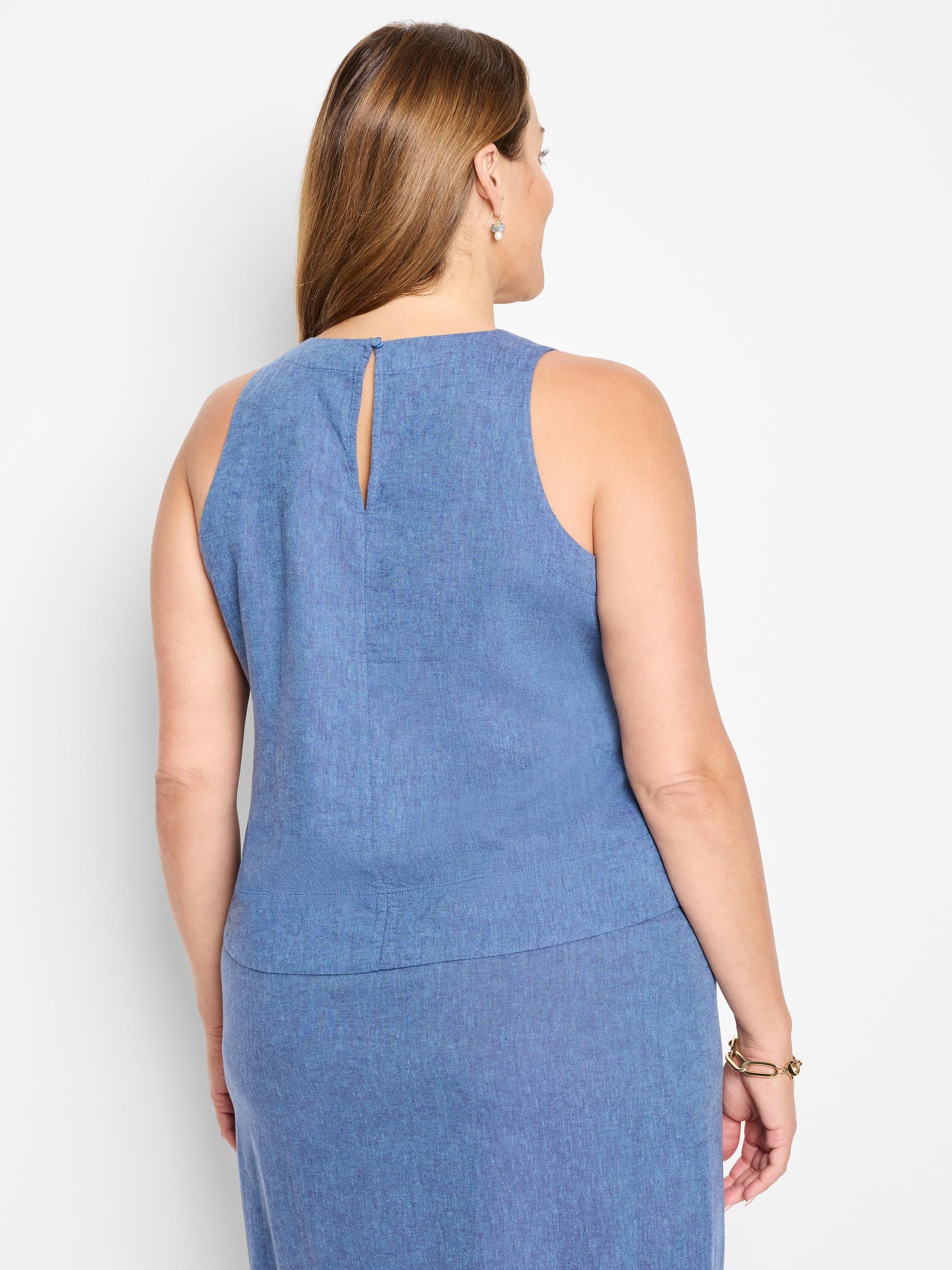 Here's alt text under 125 characters:
Blue linen sleeveless tank top, rear view. Keyhole back detail. Medium wash blue.