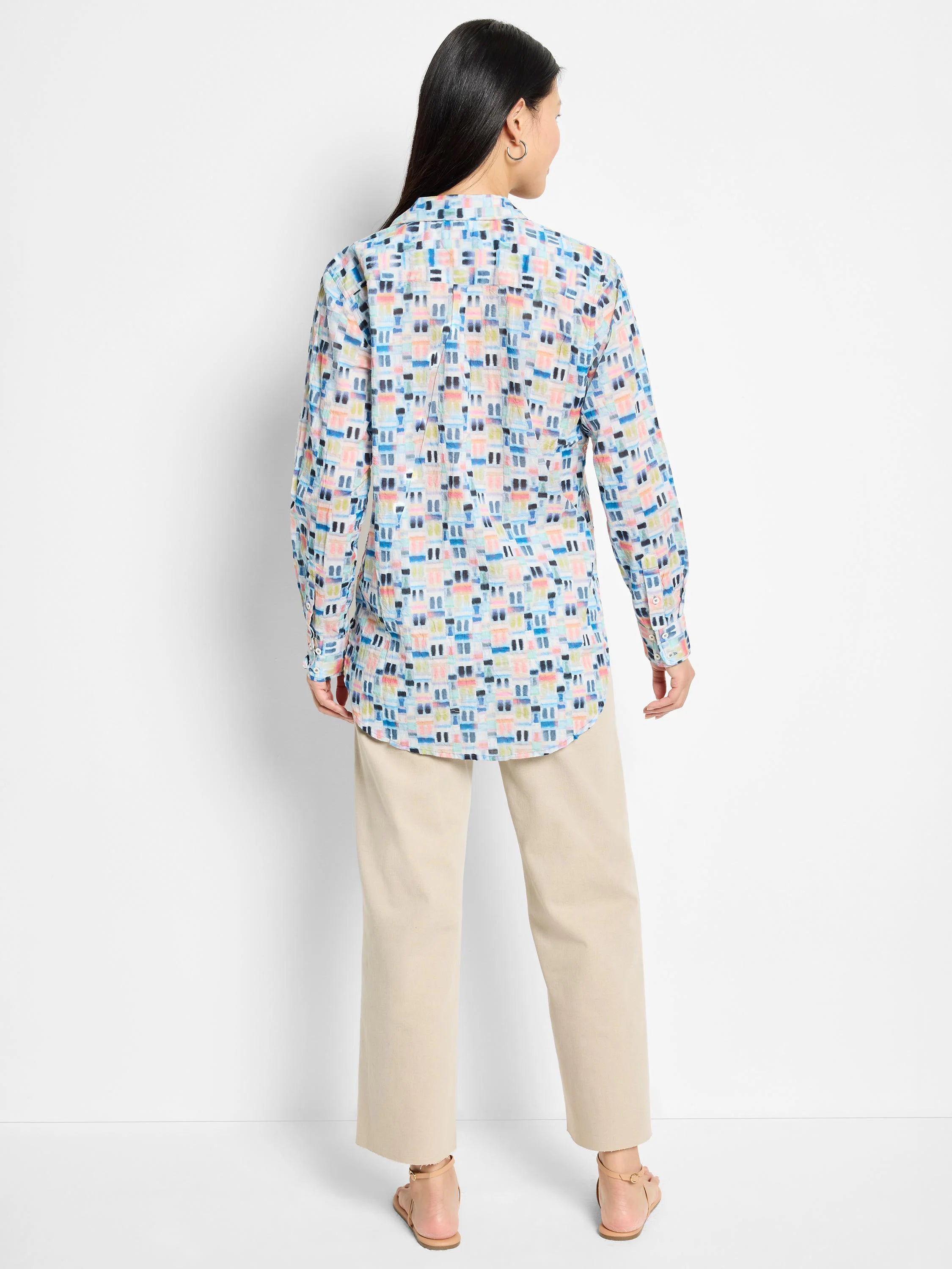 Here's alt text for the image, under 125 characters:
>Back view of a long-sleeve cotton shirt. Light blue background...