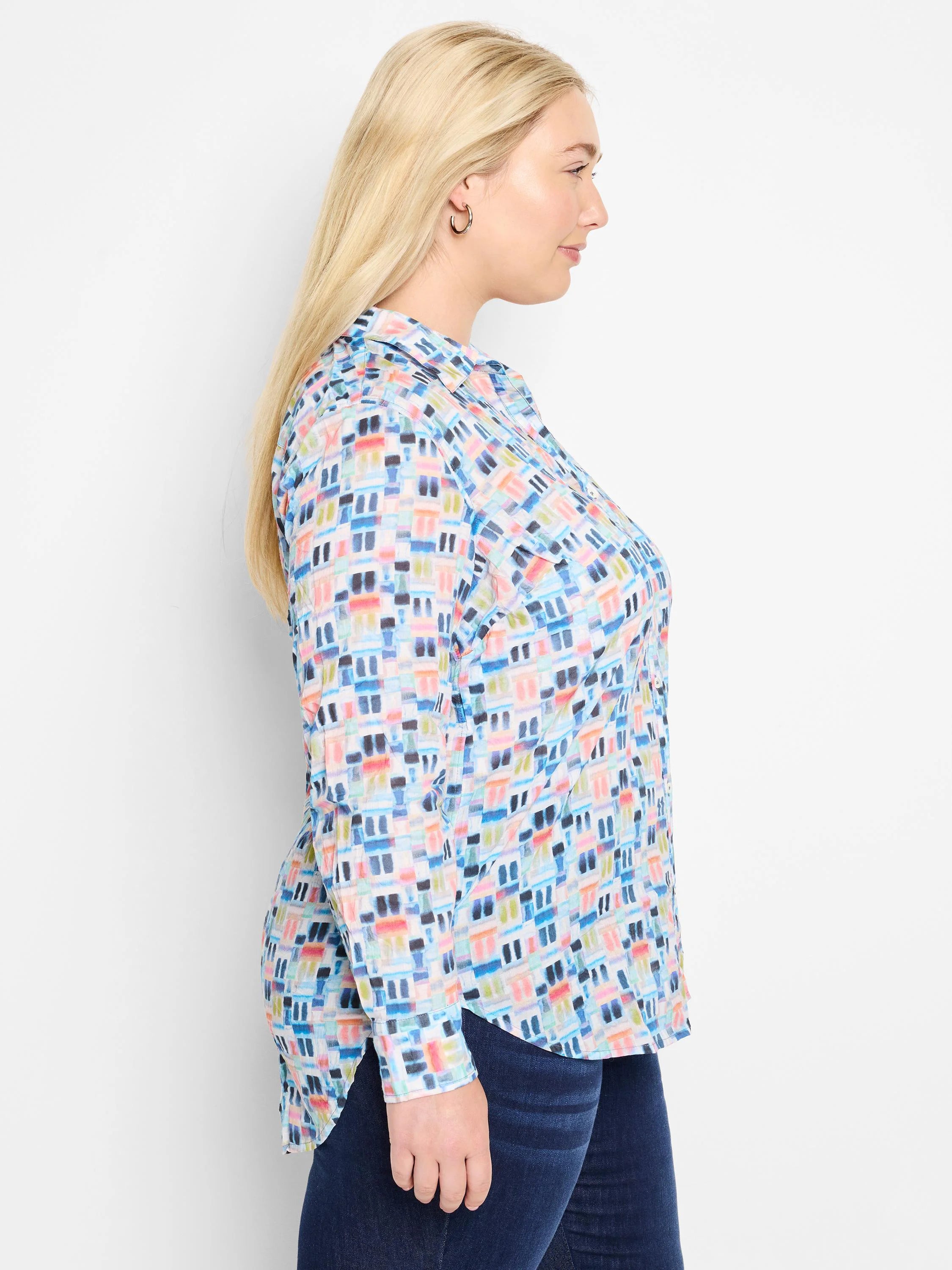 Long-sleeve collared shirt; off-white background with blue, pink, & coral abstract block print.