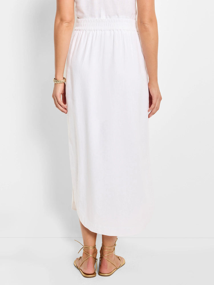 White linen midi skirt with elastic waistband; slight A-line shape, side slits.