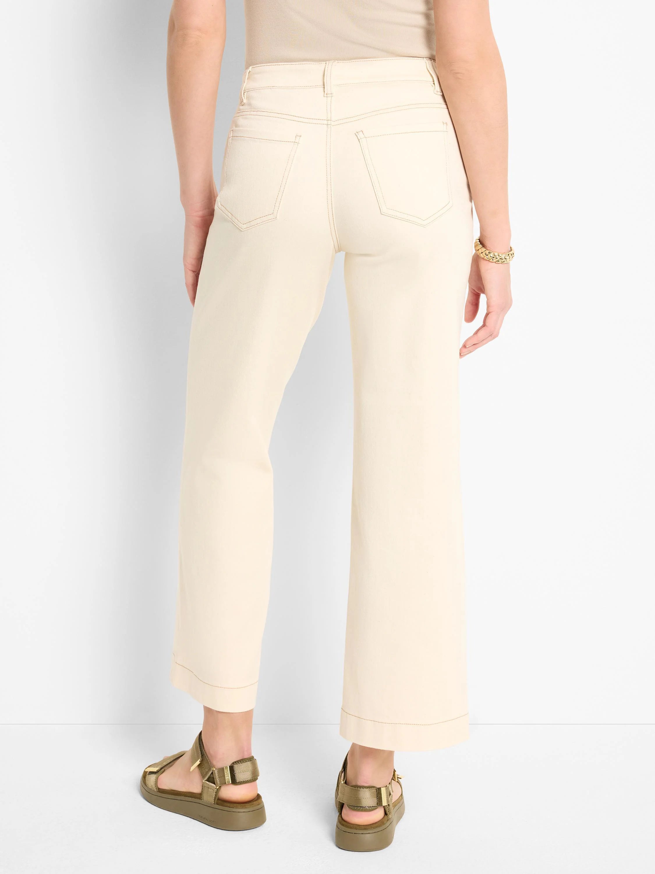 Off-white wide-leg jeans, back view. Features subtle topstitching.