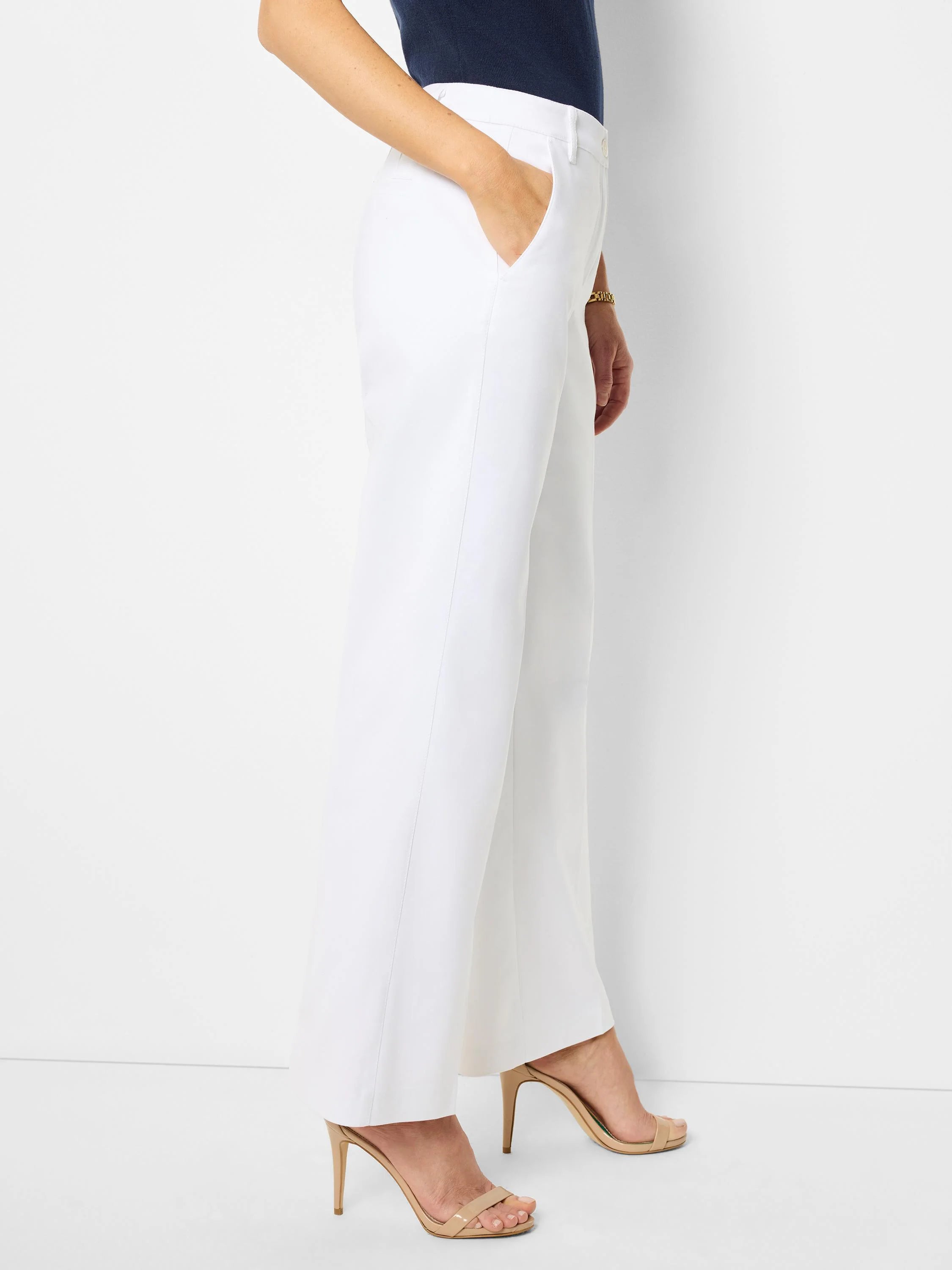 White wide-leg trousers;  shown on model with nude heels.