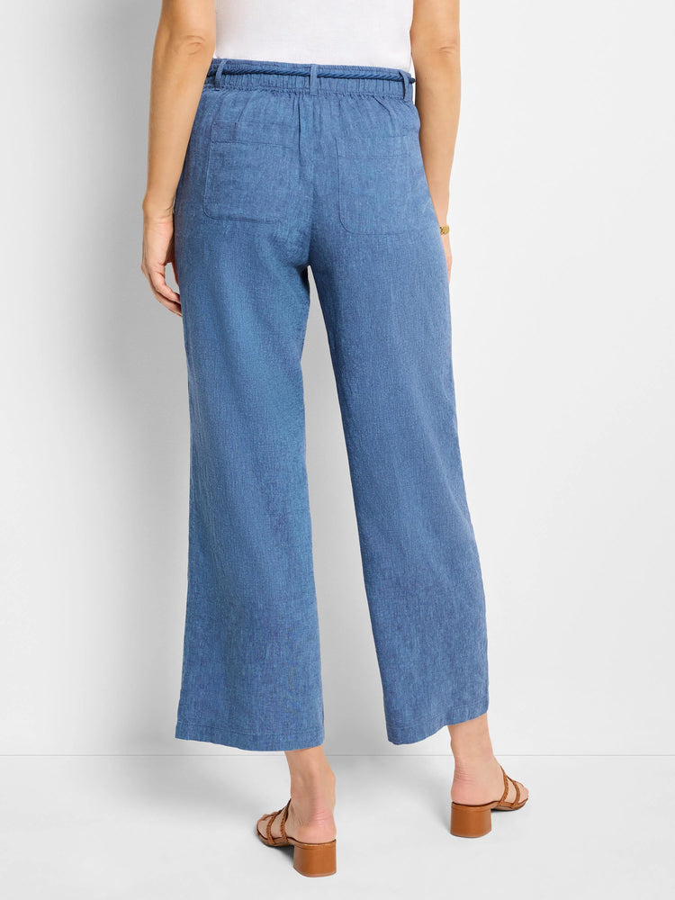 Here's alt text for the image, aiming for under 125 characters:
"Blue linen wide-leg pants with a drawstring waist. ...