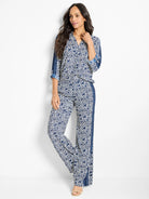 Wide-leg pants in navy blue and white geometric print.  Side panels feature a darker blue vertical stripe.