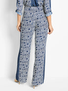 Wide-leg pants; navy blue and white geometric print, with vertical stripes along the sides.