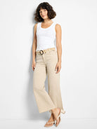 Sand-colored wide-leg jeans with a raw hem.