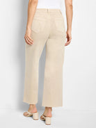 Back view of light beige wide leg jeans with high waist, back pockets, and frayed raw hems.