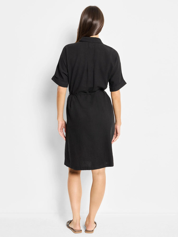 Black linen dress, short sleeves, collared neckline, belted waist. Back view.