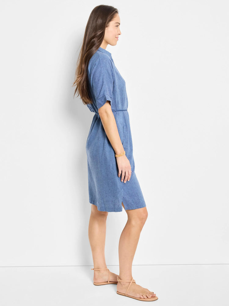 Blue linen belted shirt dress, knee-length, short sleeves. Side view.