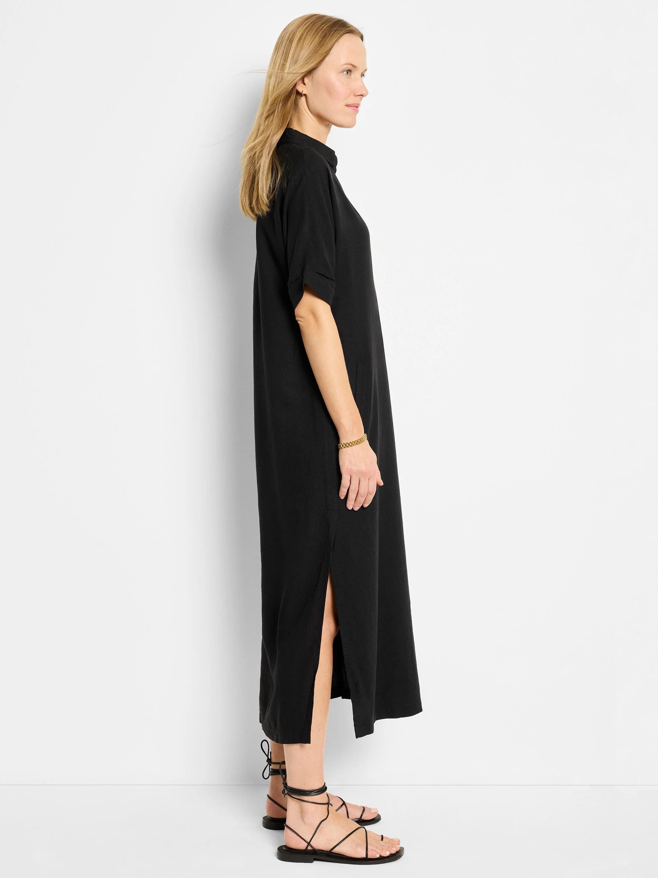 Black linen tunic dress, midi length, short sleeves, side slits.
