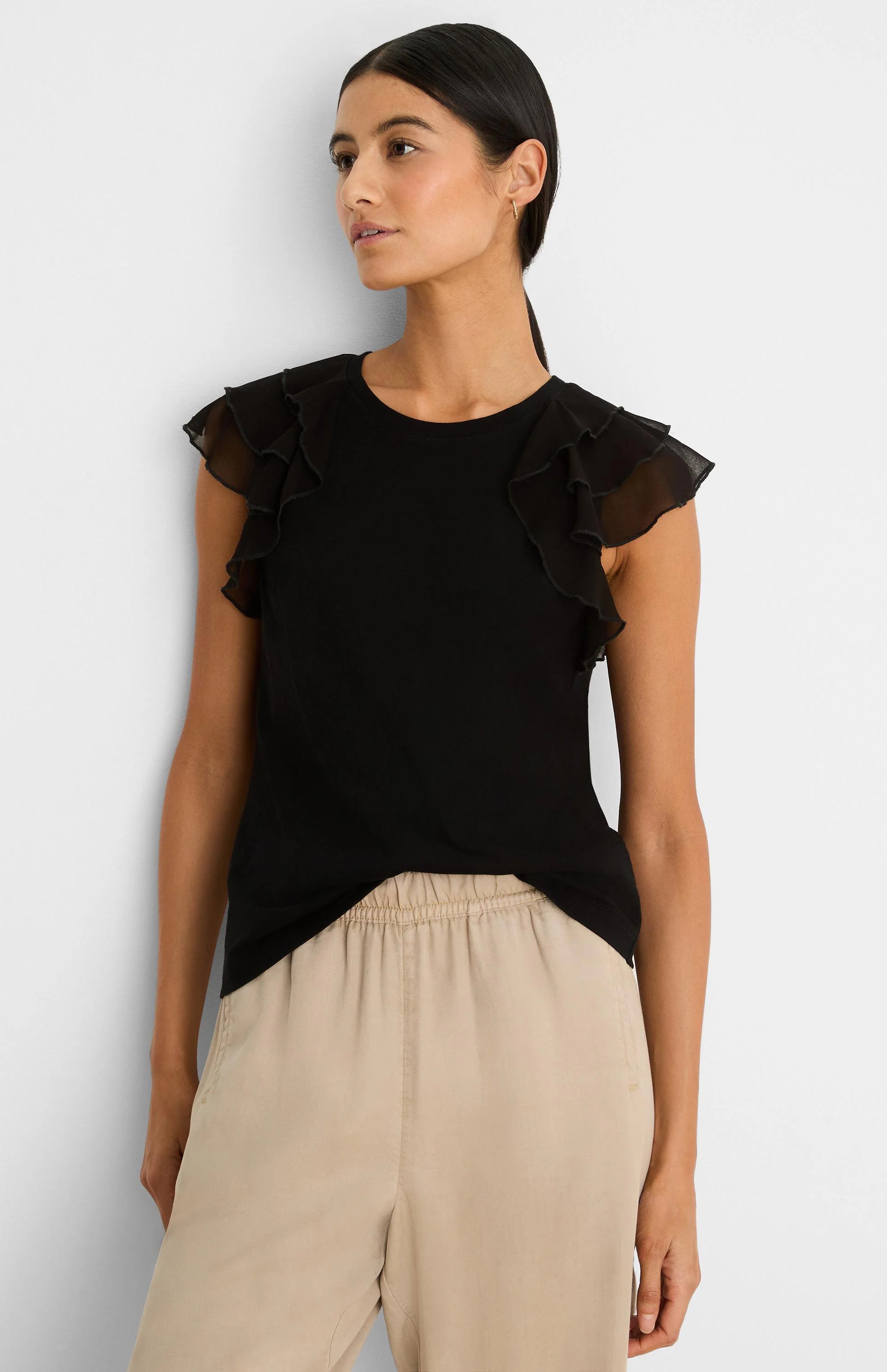 Black top with chiffon ruffle cap sleeves.