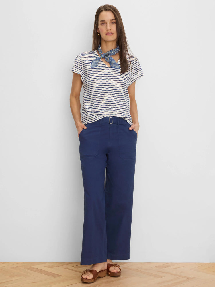 Cream short-sleeve top with horizontal navy diamond stripes.