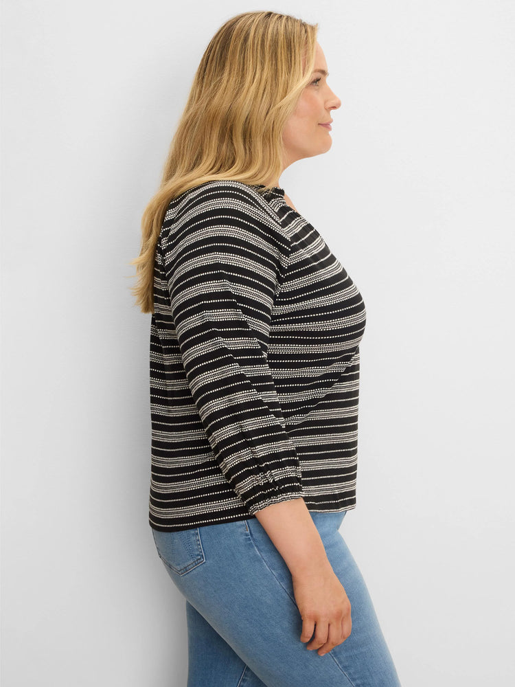Black and off-white knit top with horizontal dotted stripes and elasticized 3/4 length sleeves.