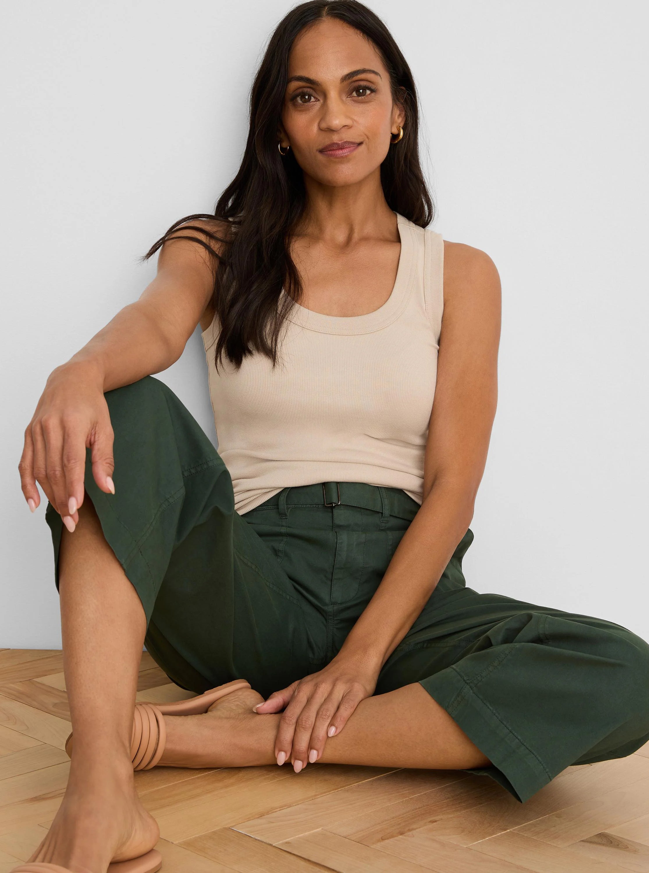 Light tan ribbed scoop neck tank on a woman.
