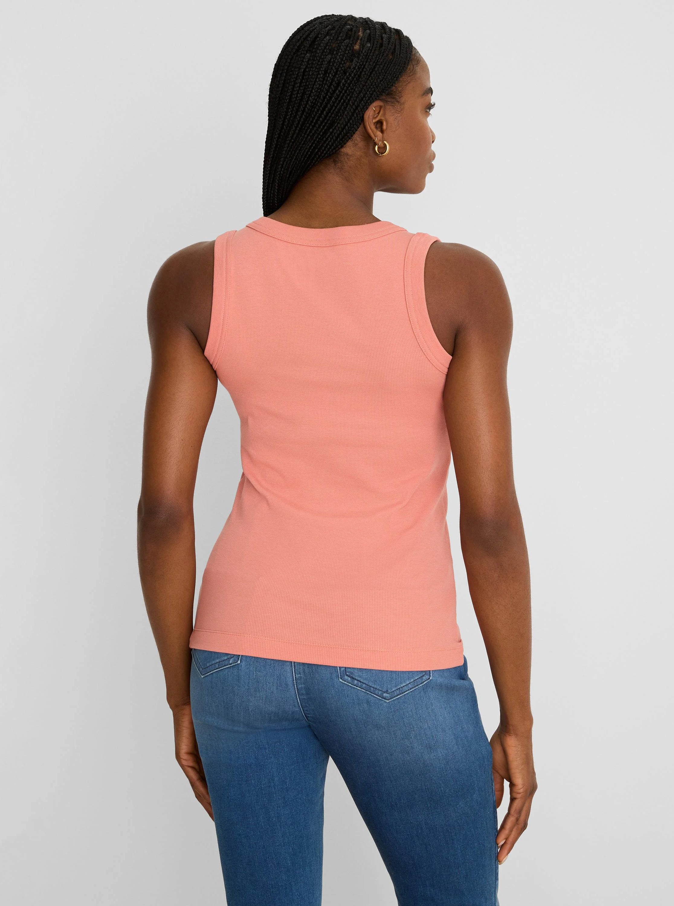 Light peach ribbed knit scoop tank top, fitted and sleeveless, shown on a model from behind.