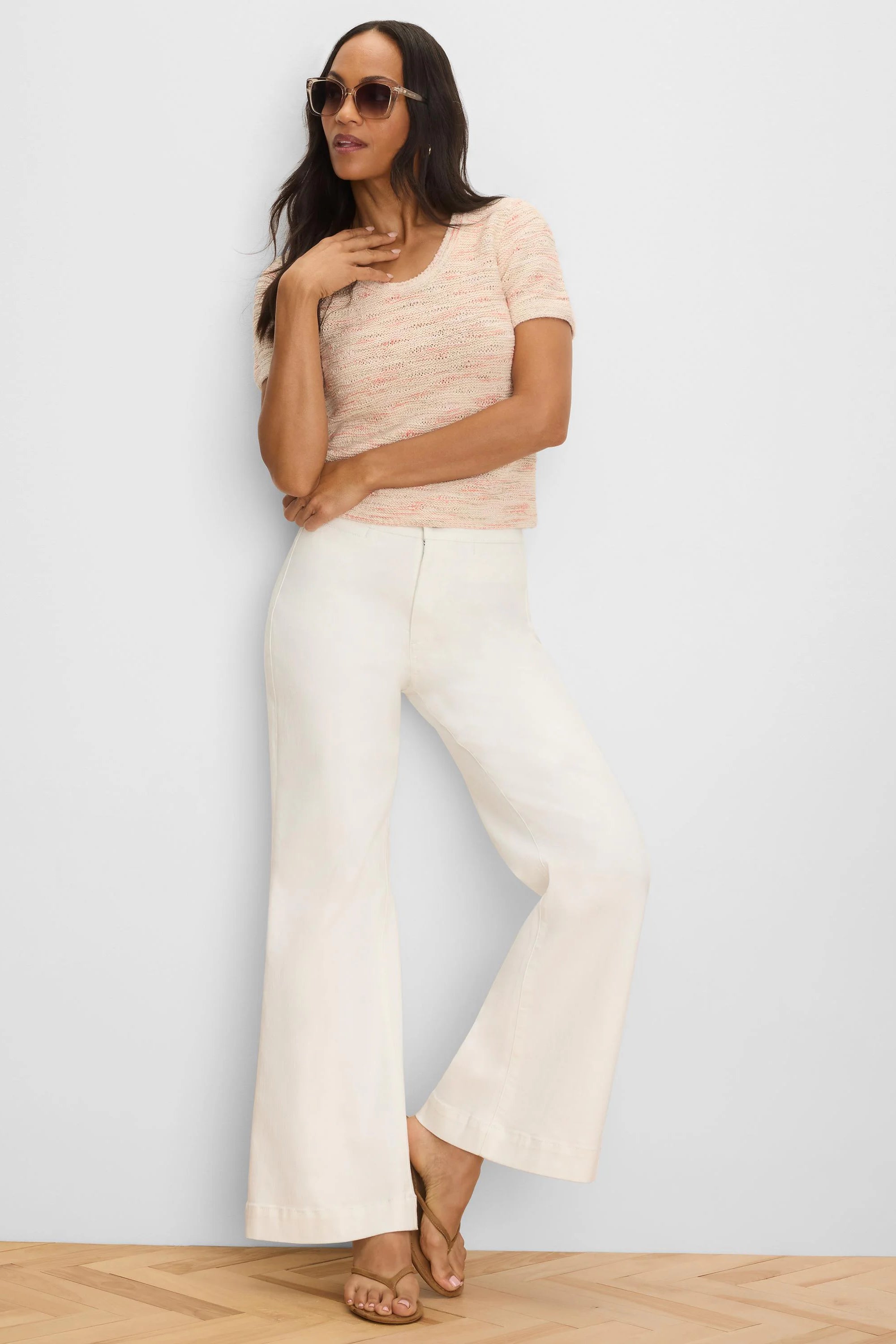 Light peach short-sleeve sweater tee with subtle pink waves in the woven texture, scoop neck.