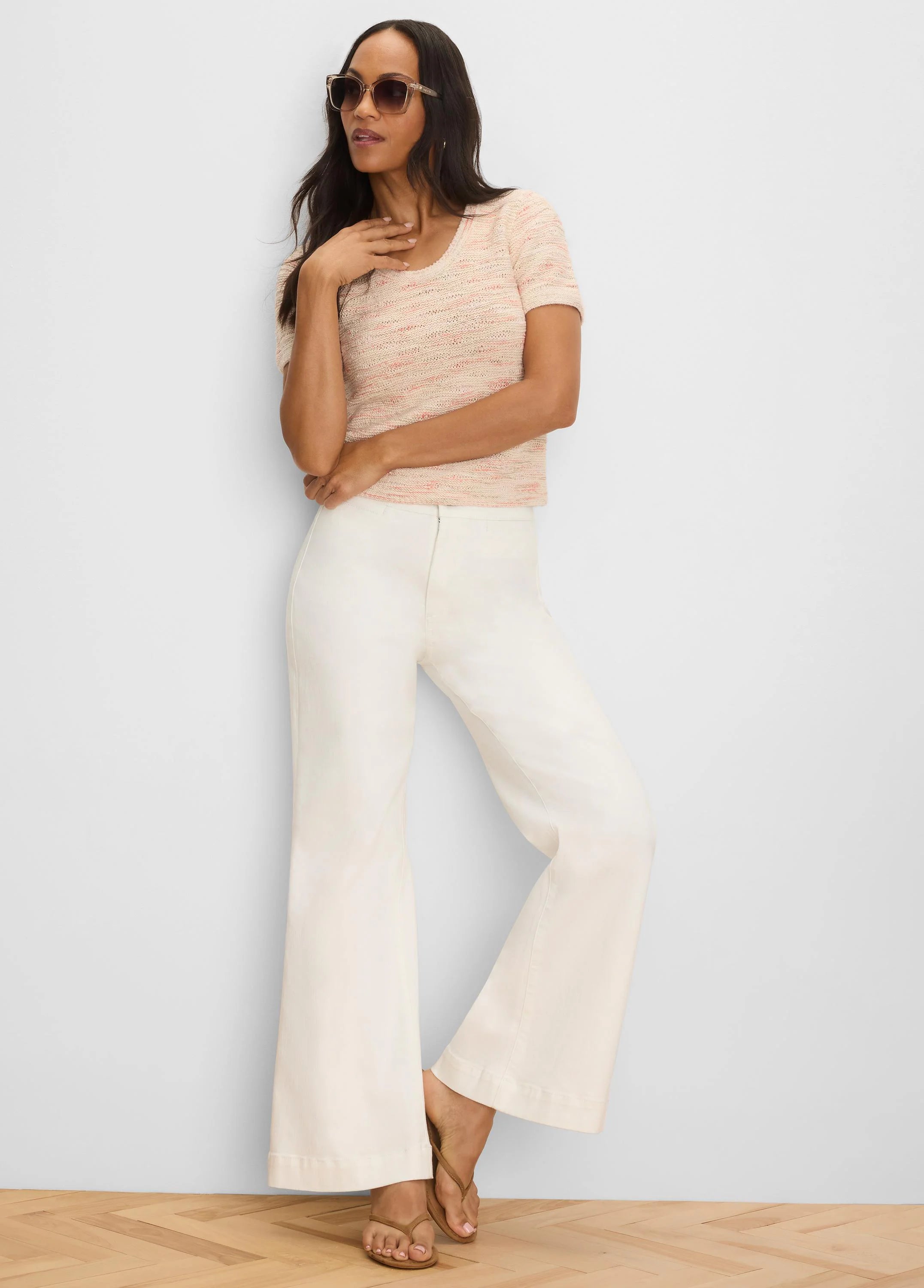 Light peach short-sleeve sweater tee with subtle pink waves in the woven texture, scoop neck.