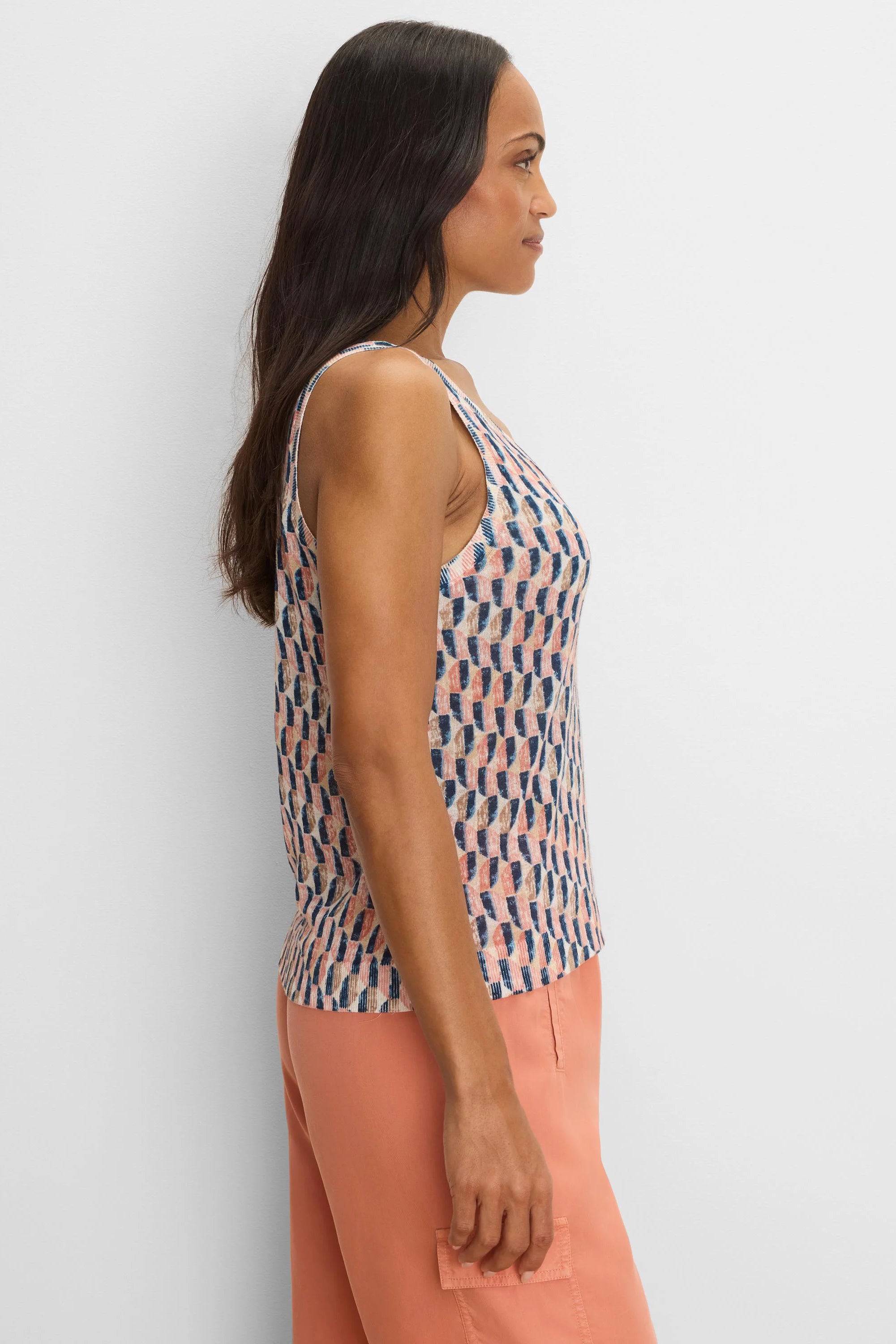 Knit tank top with an abstract sideways block pattern in peach, navy, and beige.