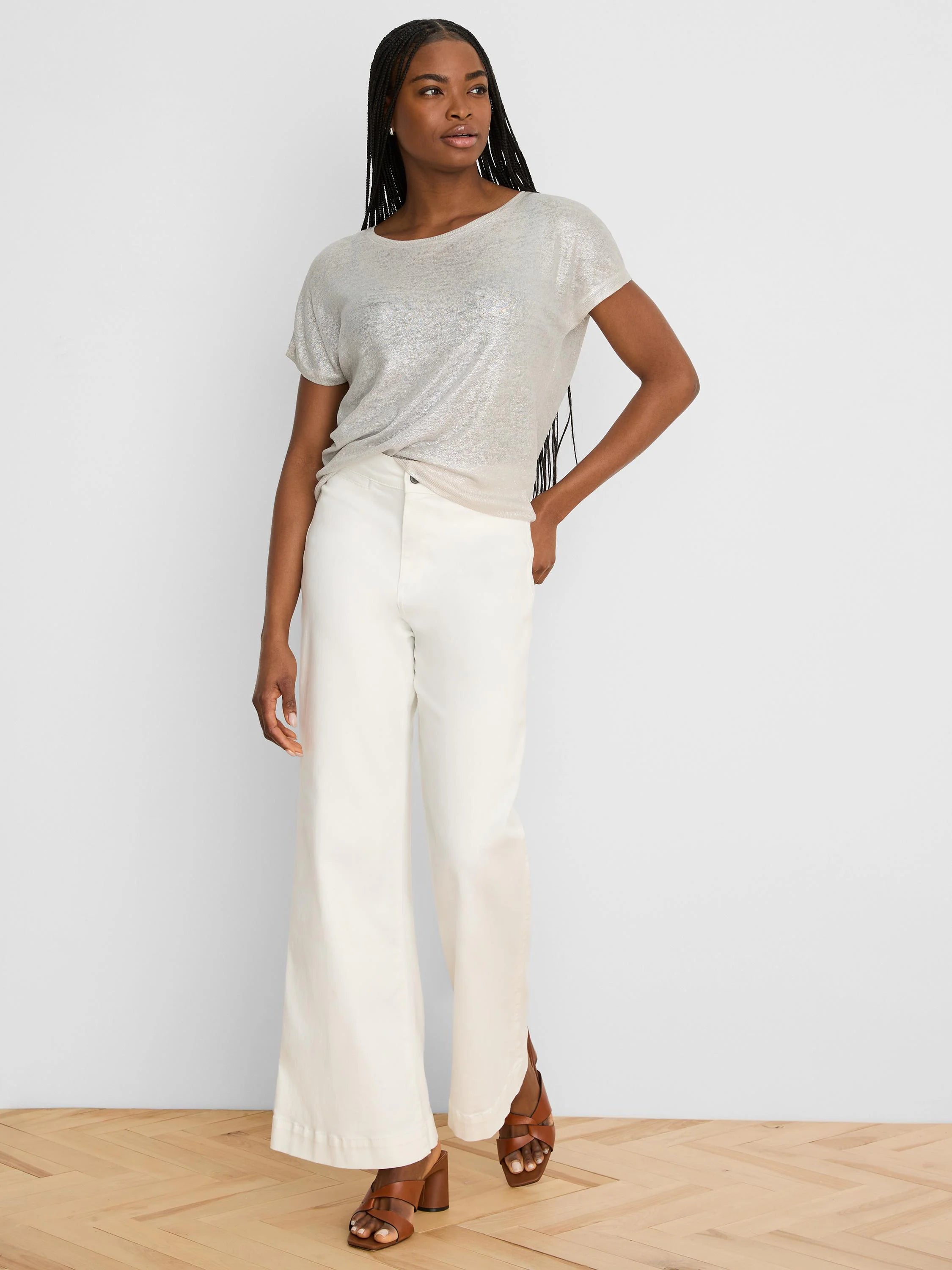 Shimmery pale gold featherknit sweater, short-sleeved with a wide scoop neck.