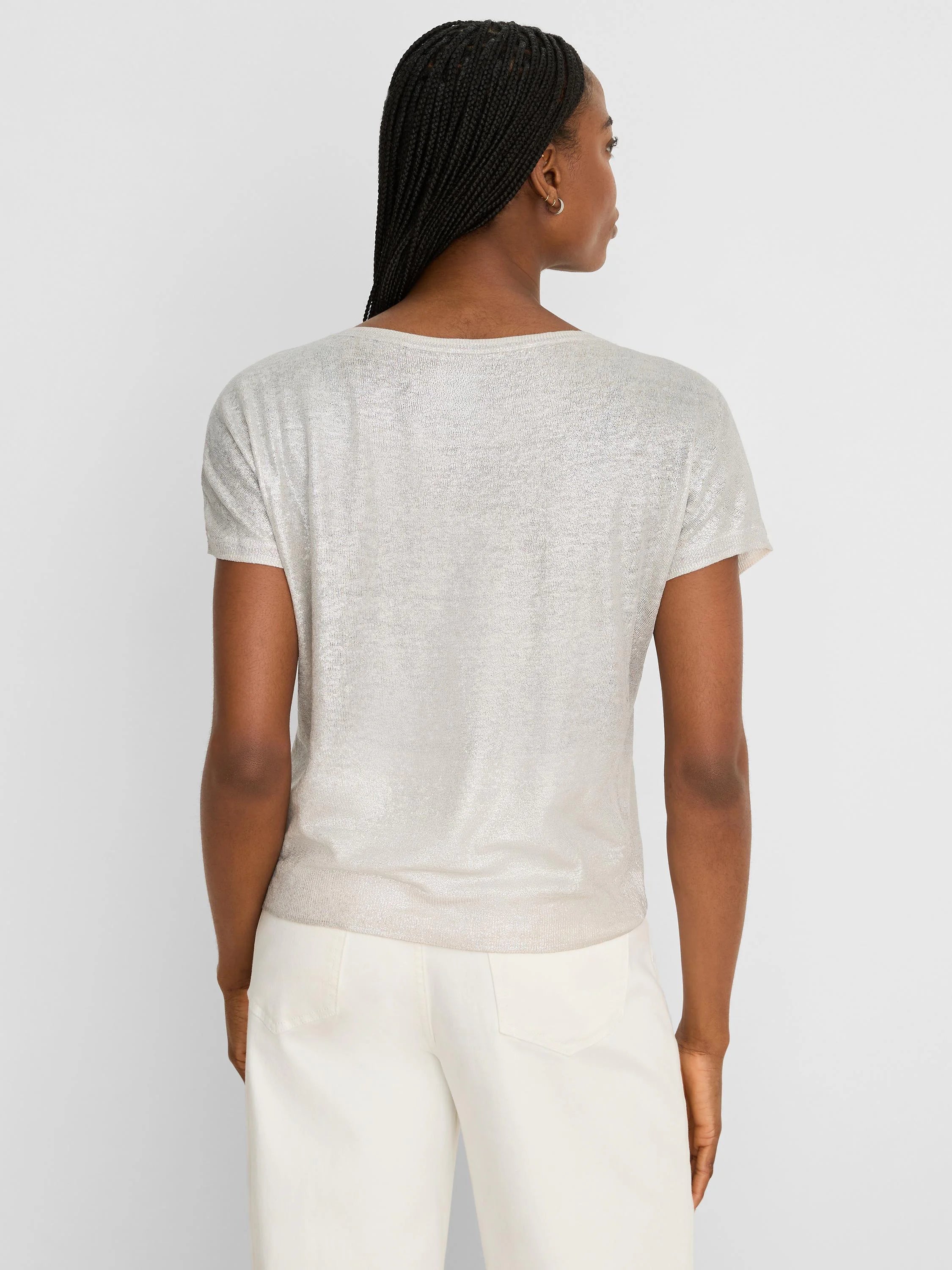 Shimmery champagne short-sleeve featherknit sweater, shown from the back on a model.