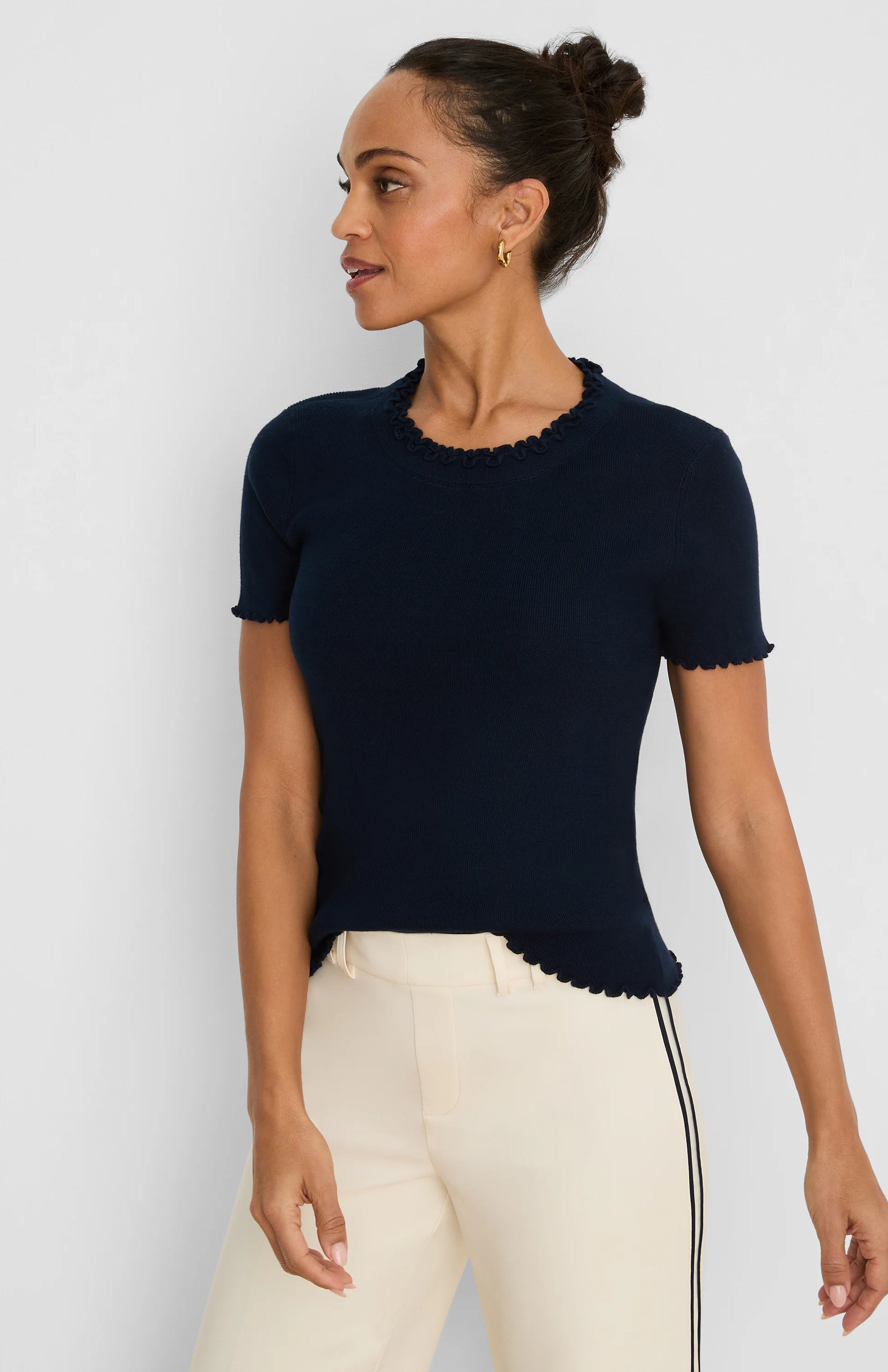 Dark navy blue short-sleeve ribbed sweater tee with ruffle trim on neckline, sleeves, and hem.