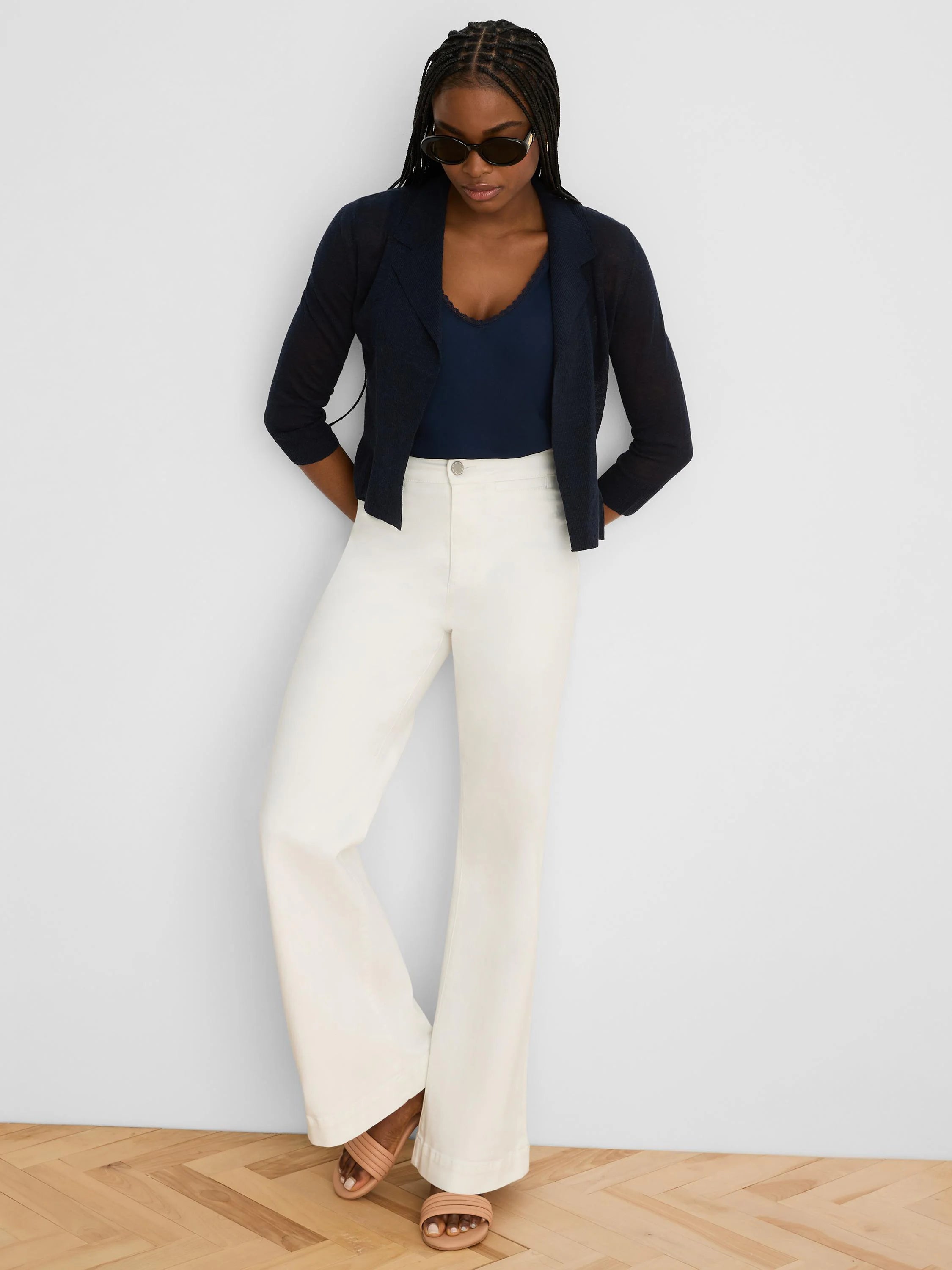 Dark blue collared cardigan with 3/4 sleeves, open fine knit texture.