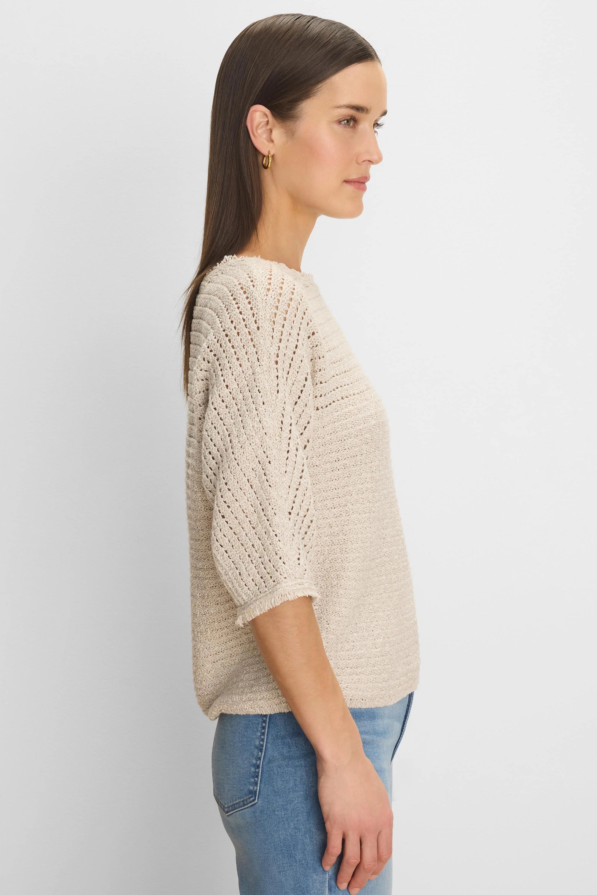 Light beige tonal texture sweater. Features include open knit patterns on shoulders/sleeves & fringed 3/4 cuffs.