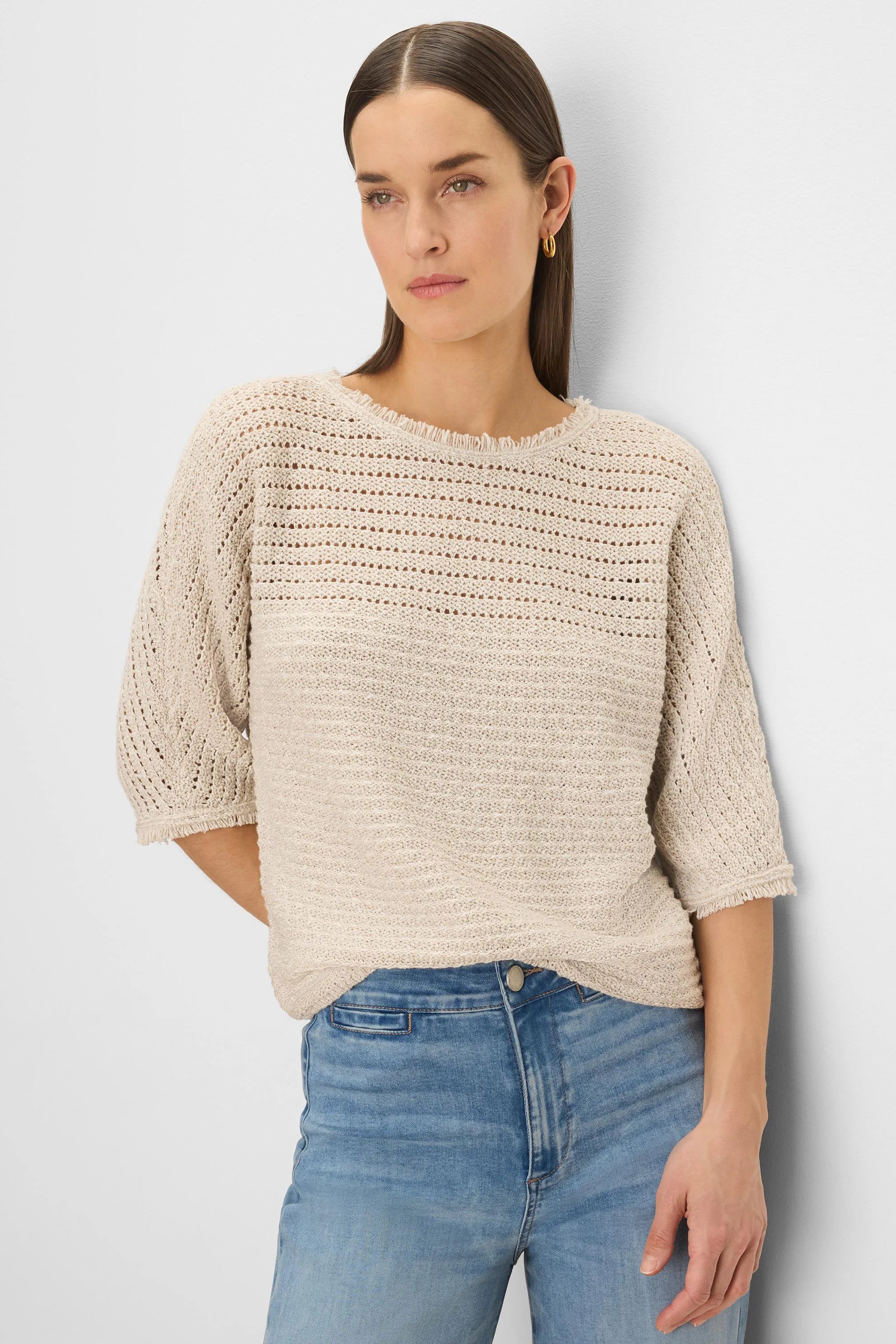 Oatmeal open-knit sweater with tonal textures, frayed neckline & 3/4 sleeves with frayed cuffs.