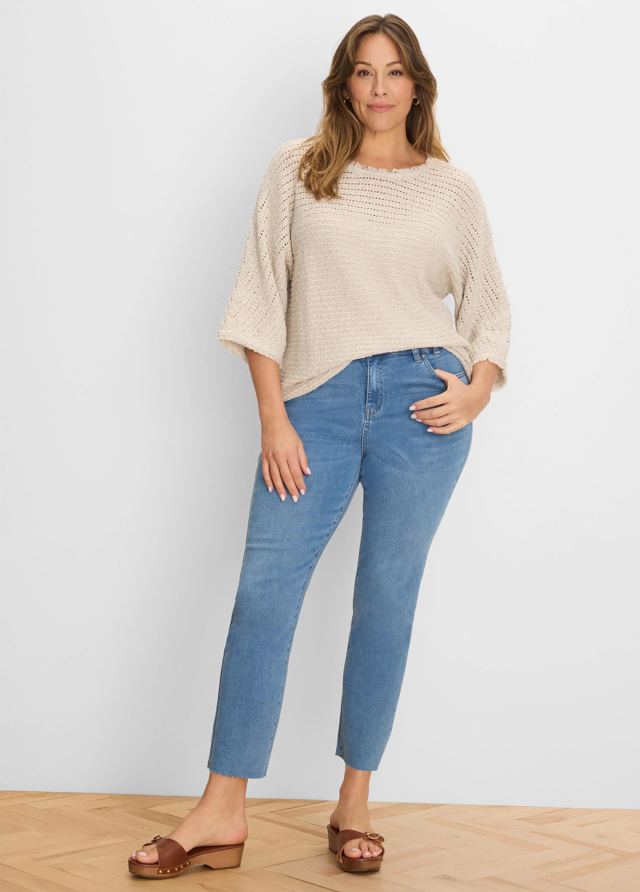 Oatmeal open-knit sweater, loose fit, with fringed neckline/cuffs and 3/4 sleeves.