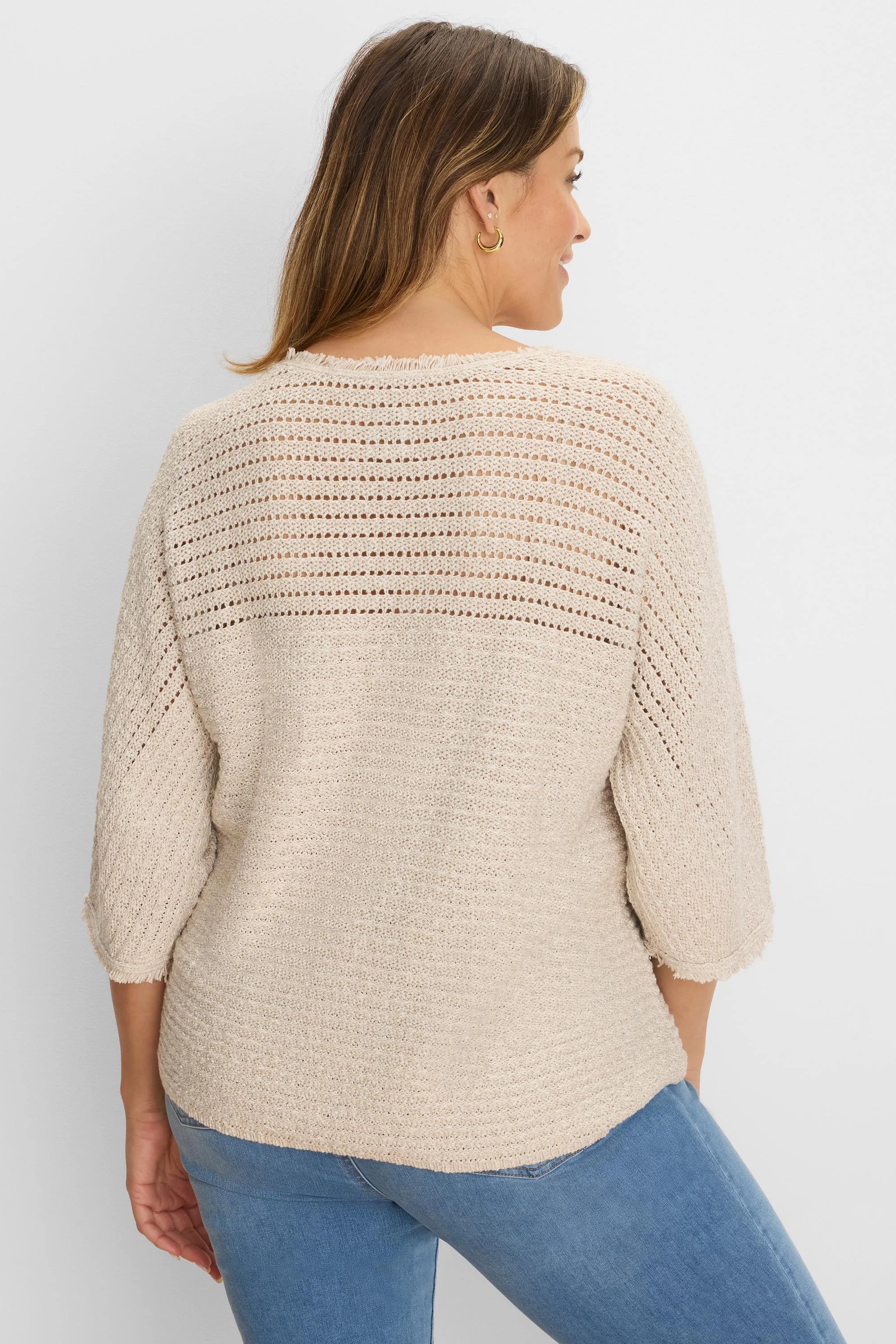 Light beige sweater with open-knit upper back/sleeves, textured knit body, and frayed 3/4 sleeve cuffs & hem.