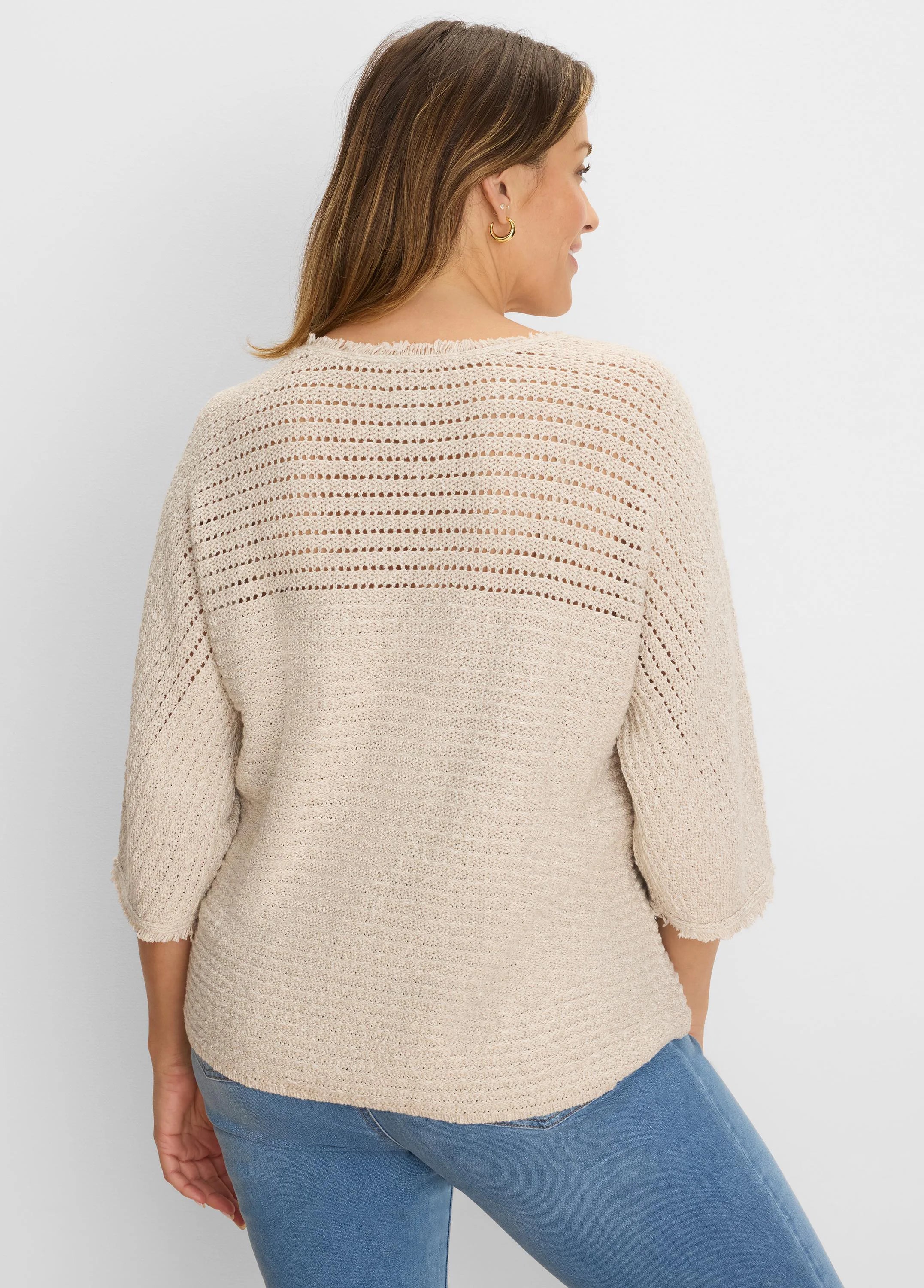 Light beige sweater with open-knit upper back/sleeves, textured knit body, and frayed 3/4 sleeve cuffs & hem.