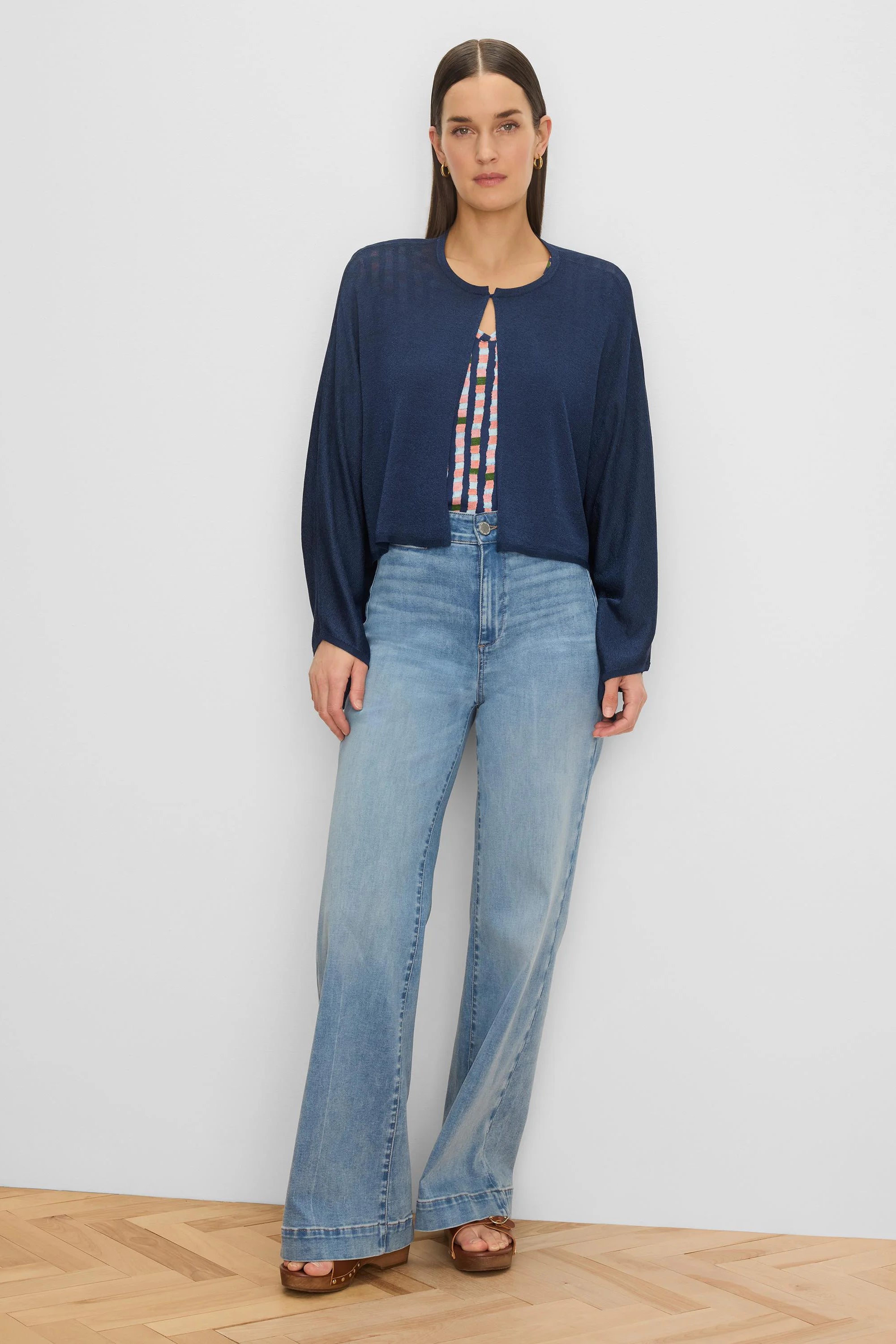 Navy blue open cardigan with long sleeves, a keyhole neck, and a slightly sheer, lightweight fabric.