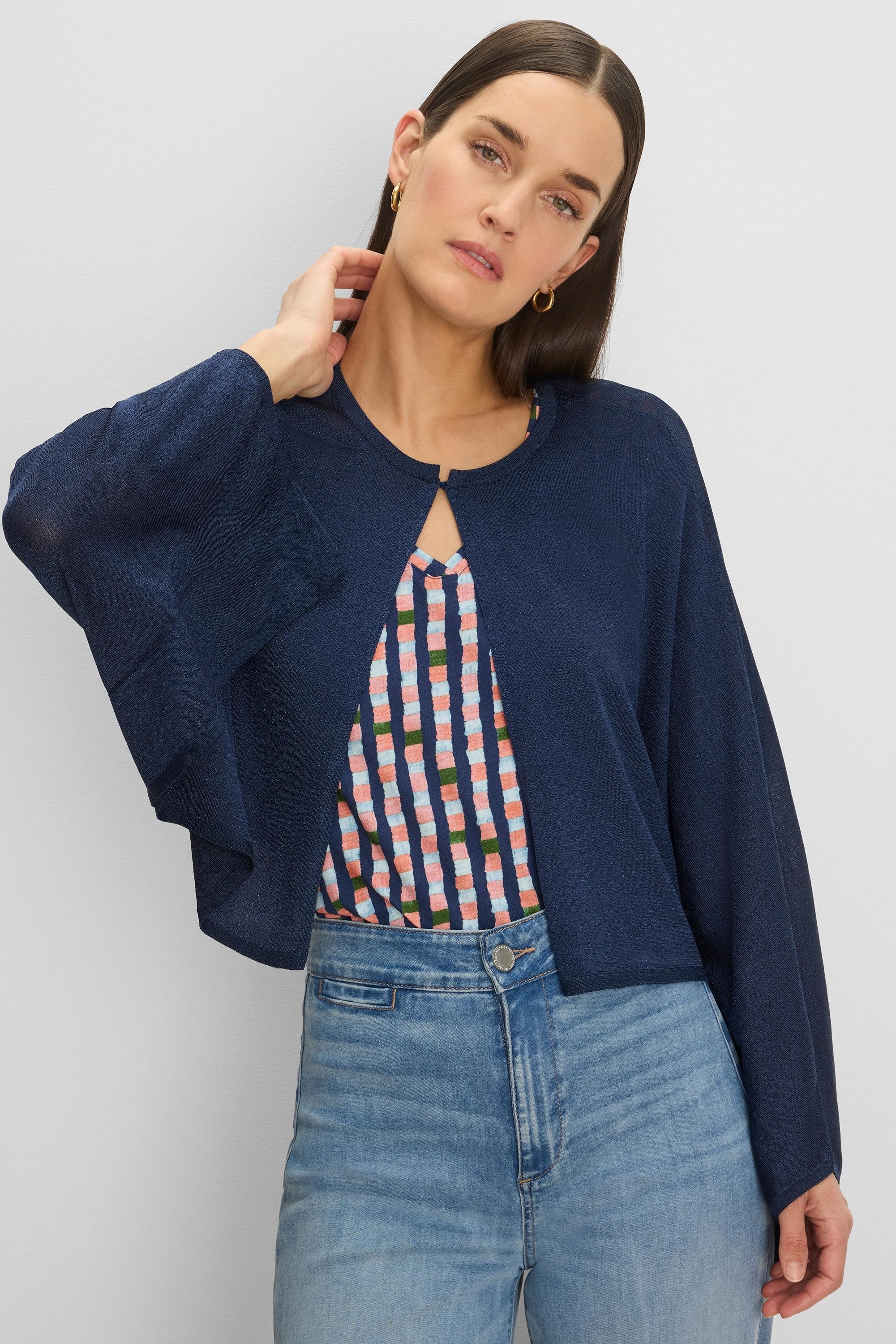 Lightweight navy blue cardigan with wide, flowing sleeves, a round neck, and a single hook closure at the top. Cropped.