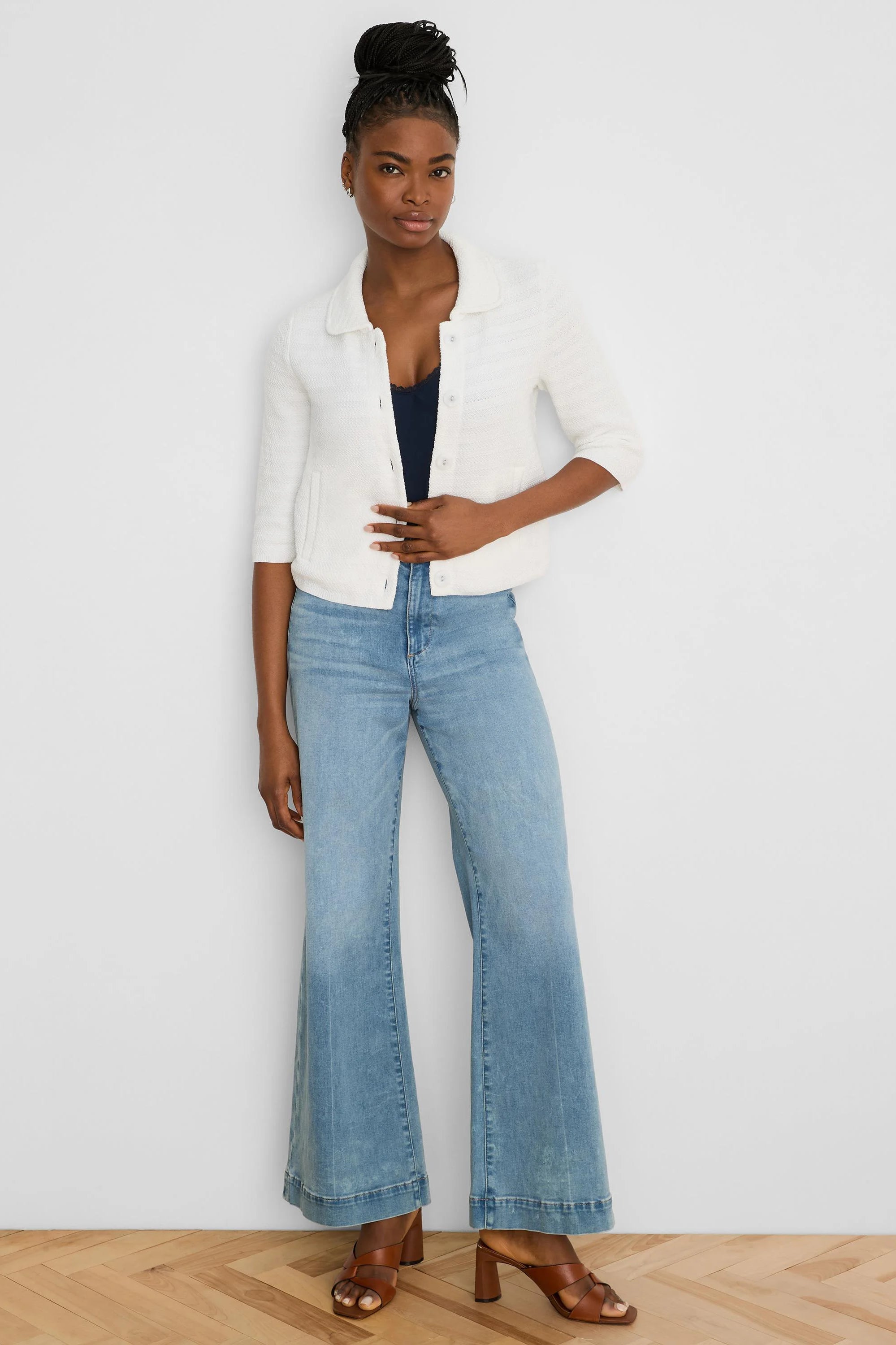 Cream textured knit jacket with elbow sleeves, collar, and front buttons.