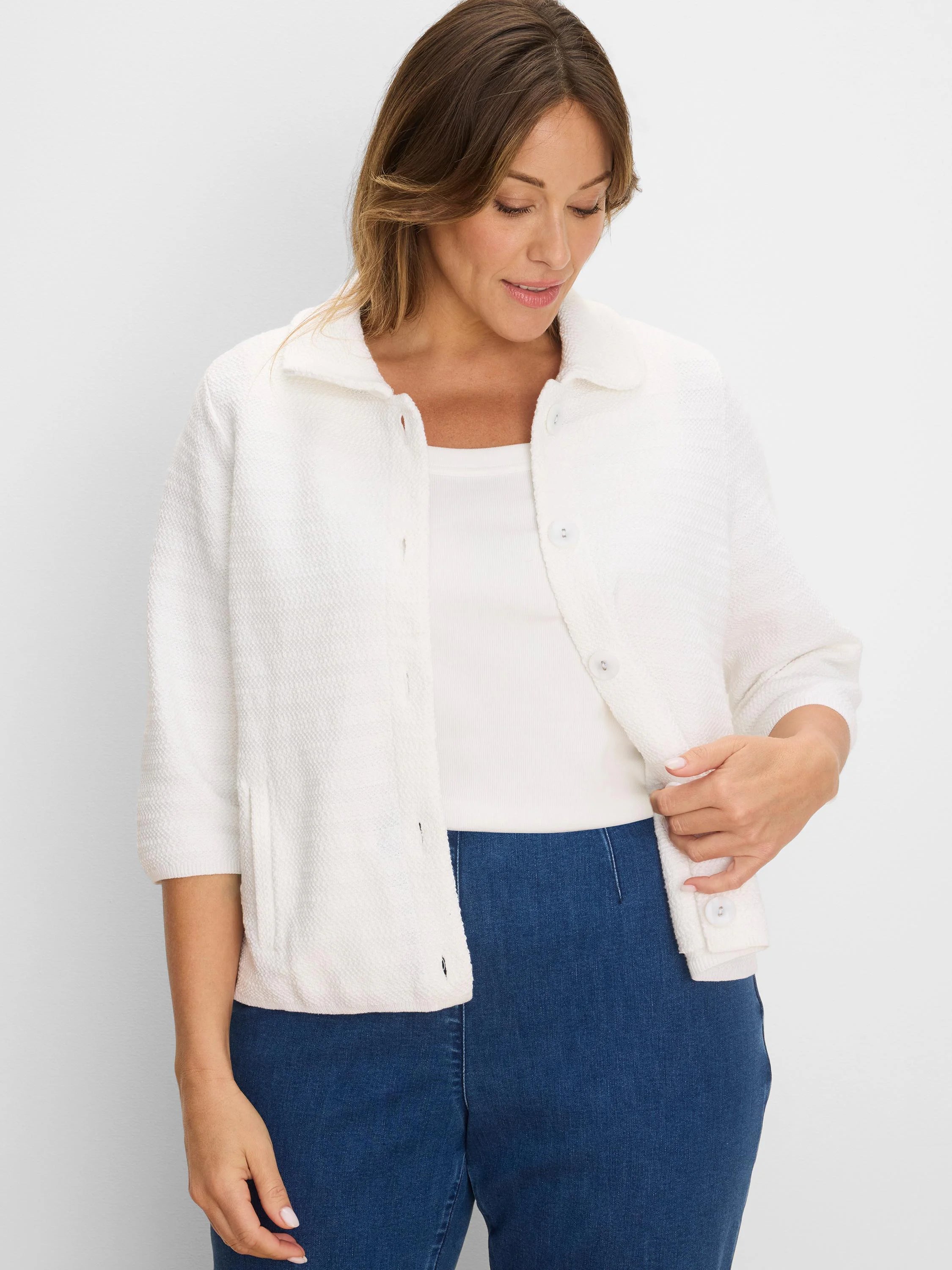 White, collared, textured knit jacket with elbow sleeves, button-front, and front patch pockets.