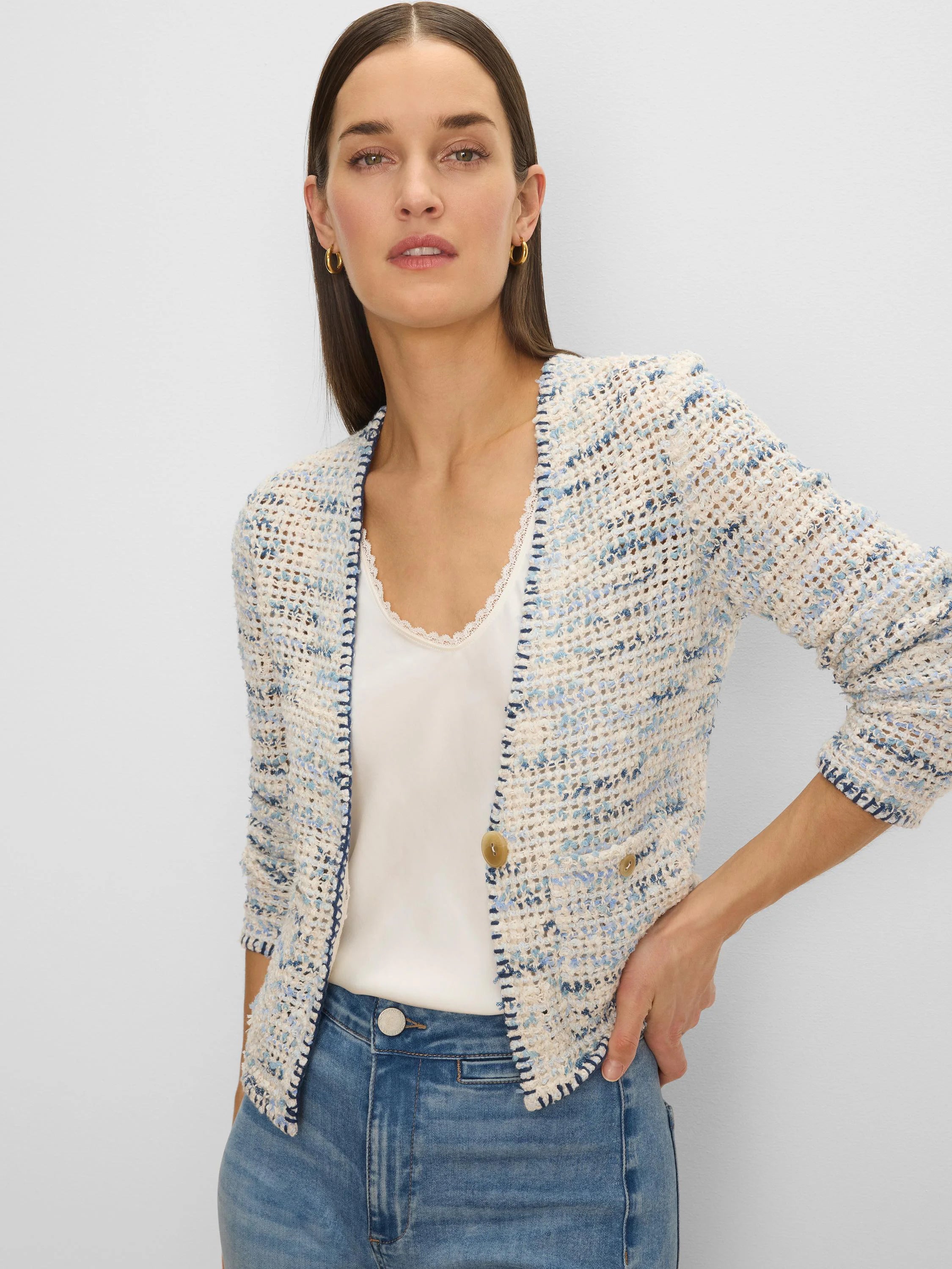Knit jacket: textured blend of cream, light blue, & navy yarns. Open front, navy trim, 3/4 sleeves, decorative tan buttons.