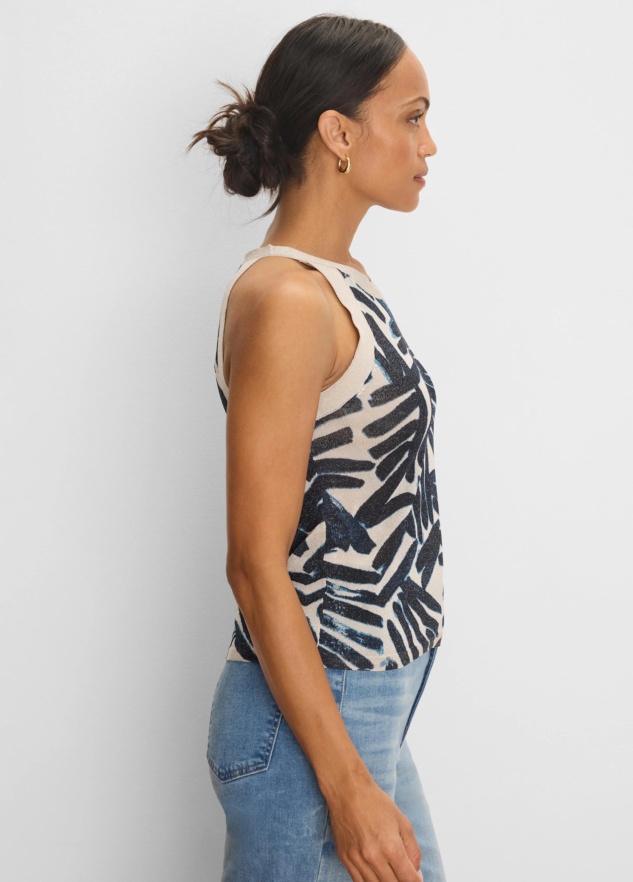 Light beige knit tank with indigo and light blue abstract brushstroke pattern. Ribbed trim.