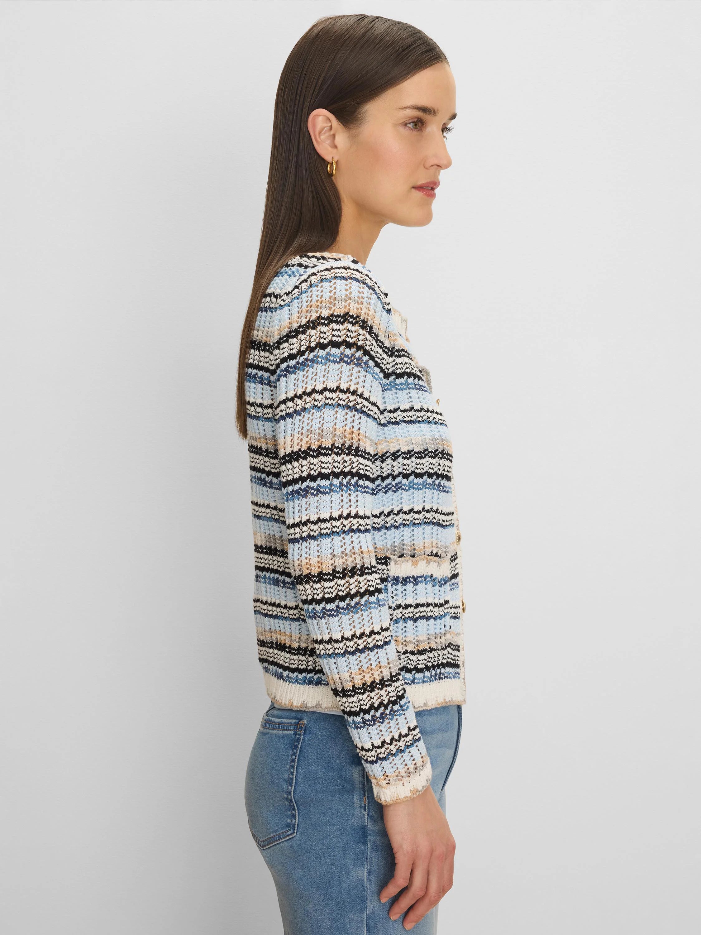 Open-knit cardigan with blue, cream, black, and tan horizontal stripes. Gold buttons visible.