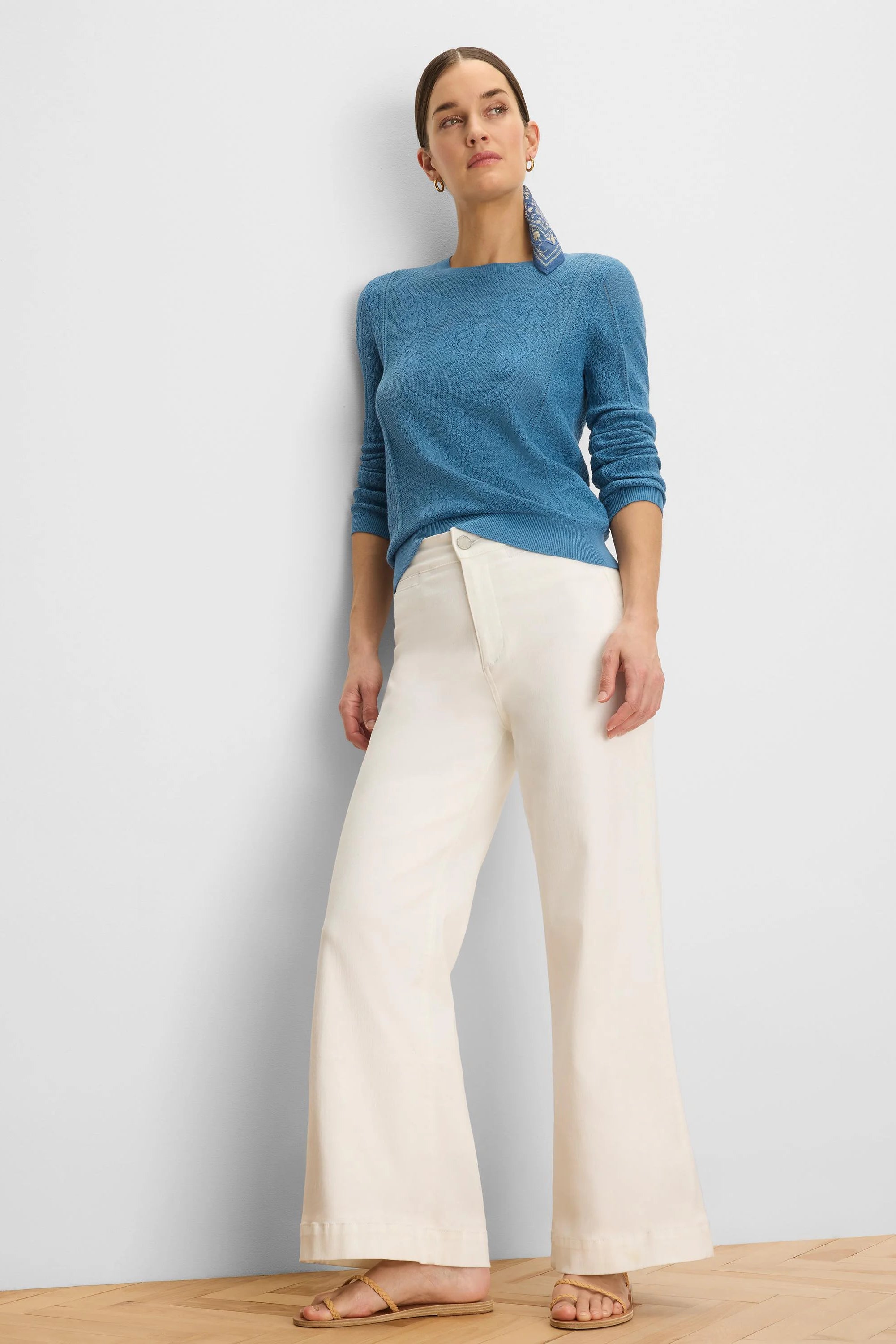 Teal blue sweater with an all-over jacquard lace knit pattern.