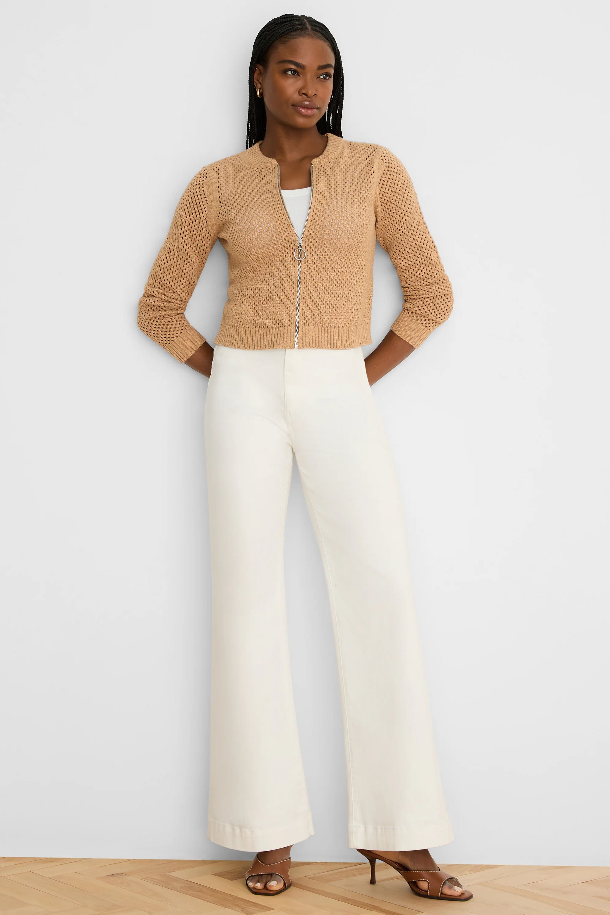 Tan mesh zip-front cardigan with a silver zipper, round neck, 3/4 sleeves, and cropped length.