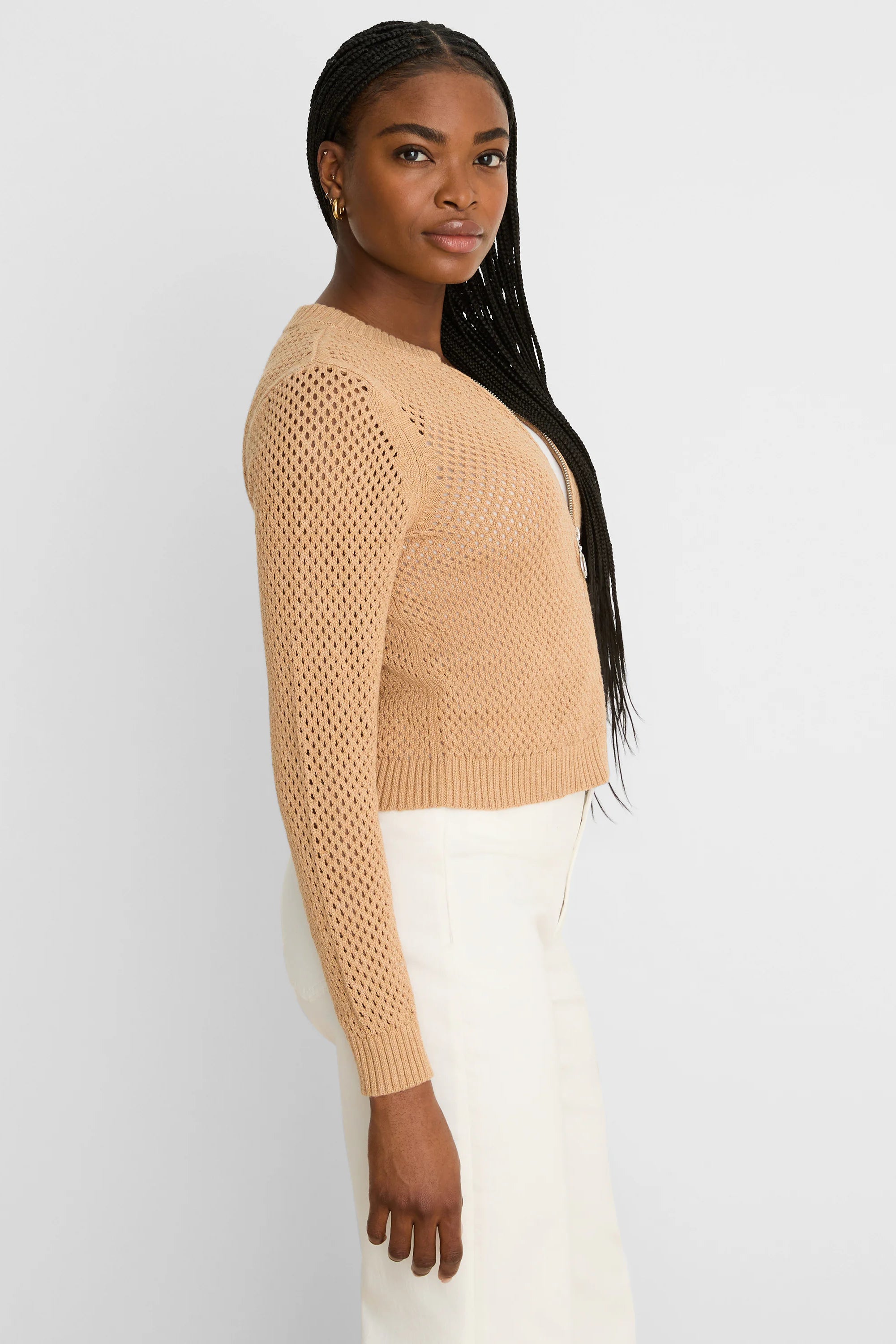 Tan long-sleeve zip-front cardigan with an open mesh knit.