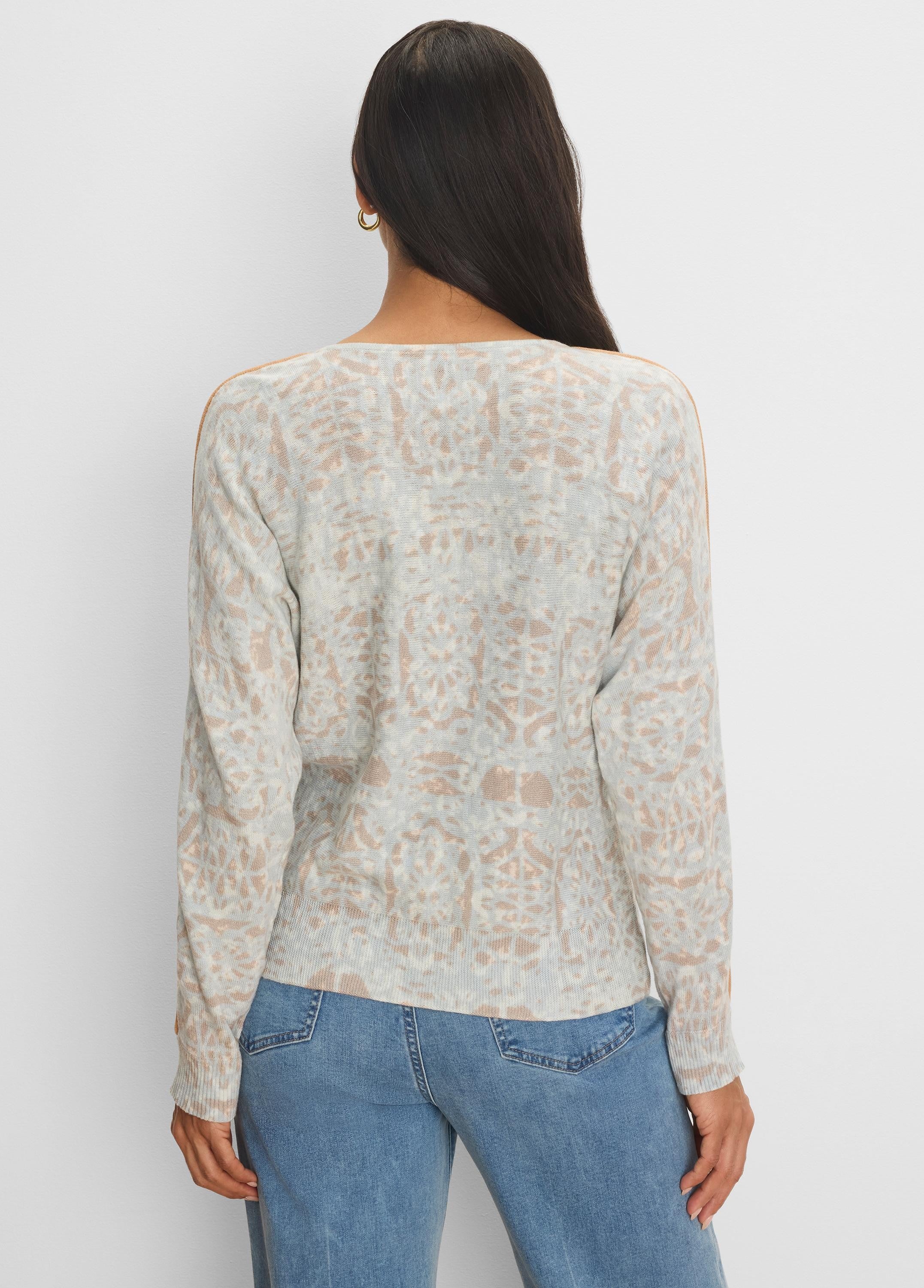 Light gray sweater with tan abstract pattern and tan shoulder tipping. Long sleeve.