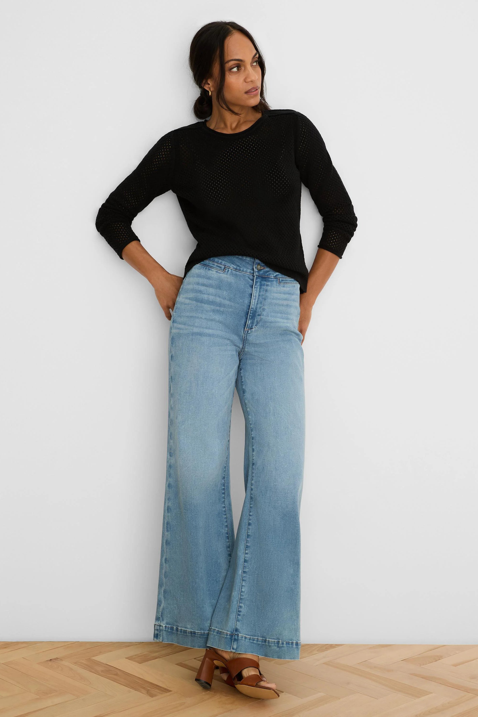 Black mesh sweater with long sleeves and a crew neck.